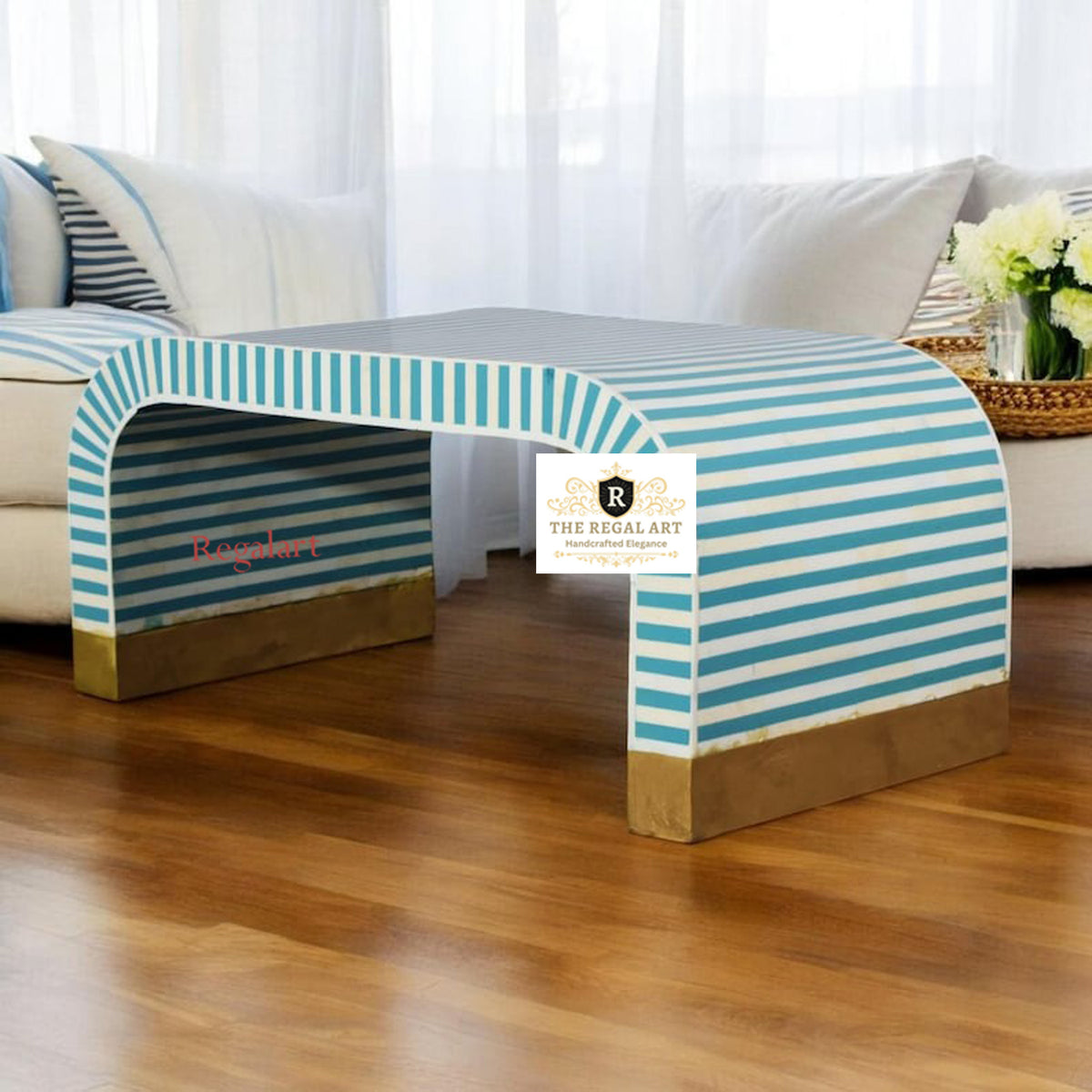 Handcrafted bone inlay coffee table with a U-shape waterfall design, featuring a striped pattern on the upholstered section and a wooden frame on a living room setting.