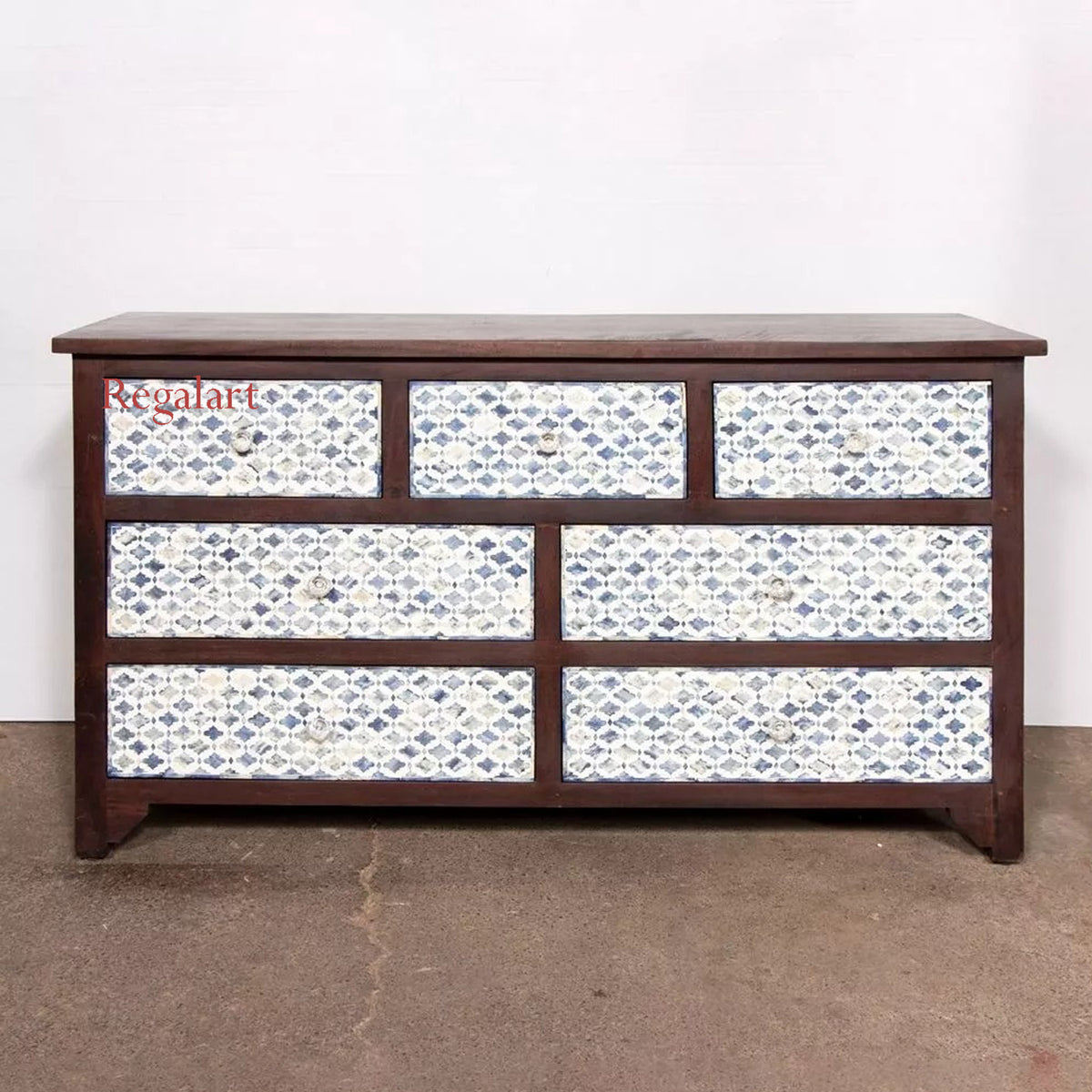 A wooden chest of drawers with blue bone inlay design on the drawer fronts, positioned against a white background.