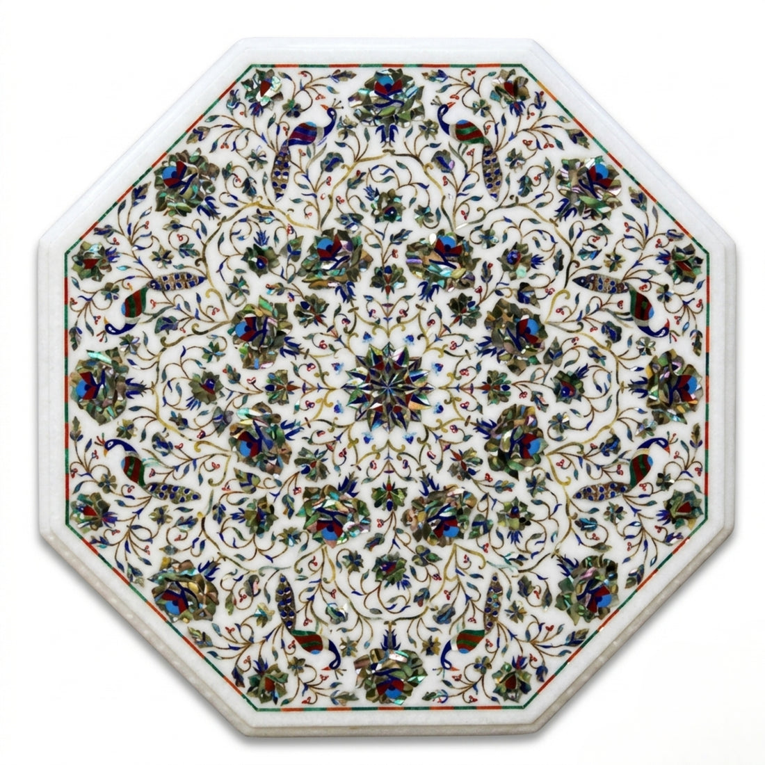 Handcrafted white marble octagonal dining table with intricate floral Pietra Dura inlay, displayed in a modern luxury dining room with contemporary chairs.
