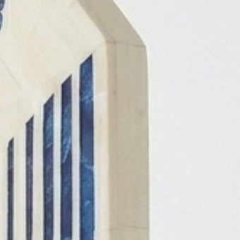 Decorative mirror with blue geometric patterns on a white background