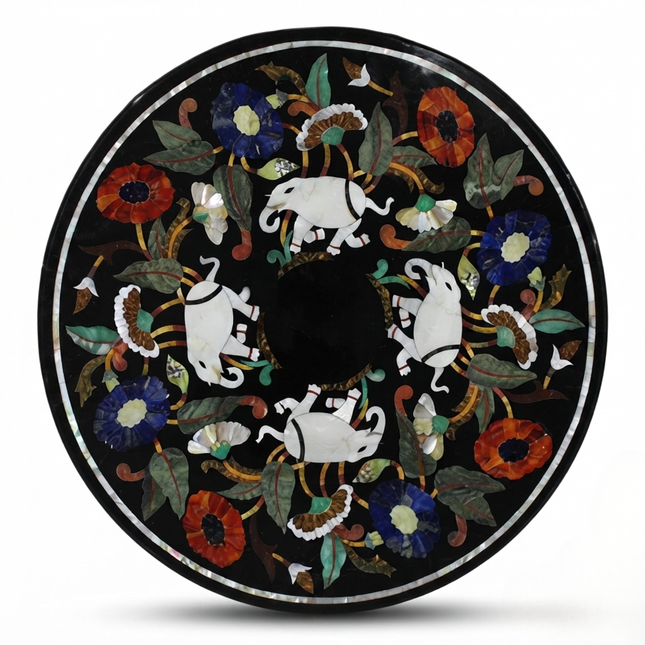 Handmade black marble round tabletop featuring white elephant and colorful floral Pietra Dura inlay with semi-precious gemstones on a white background.