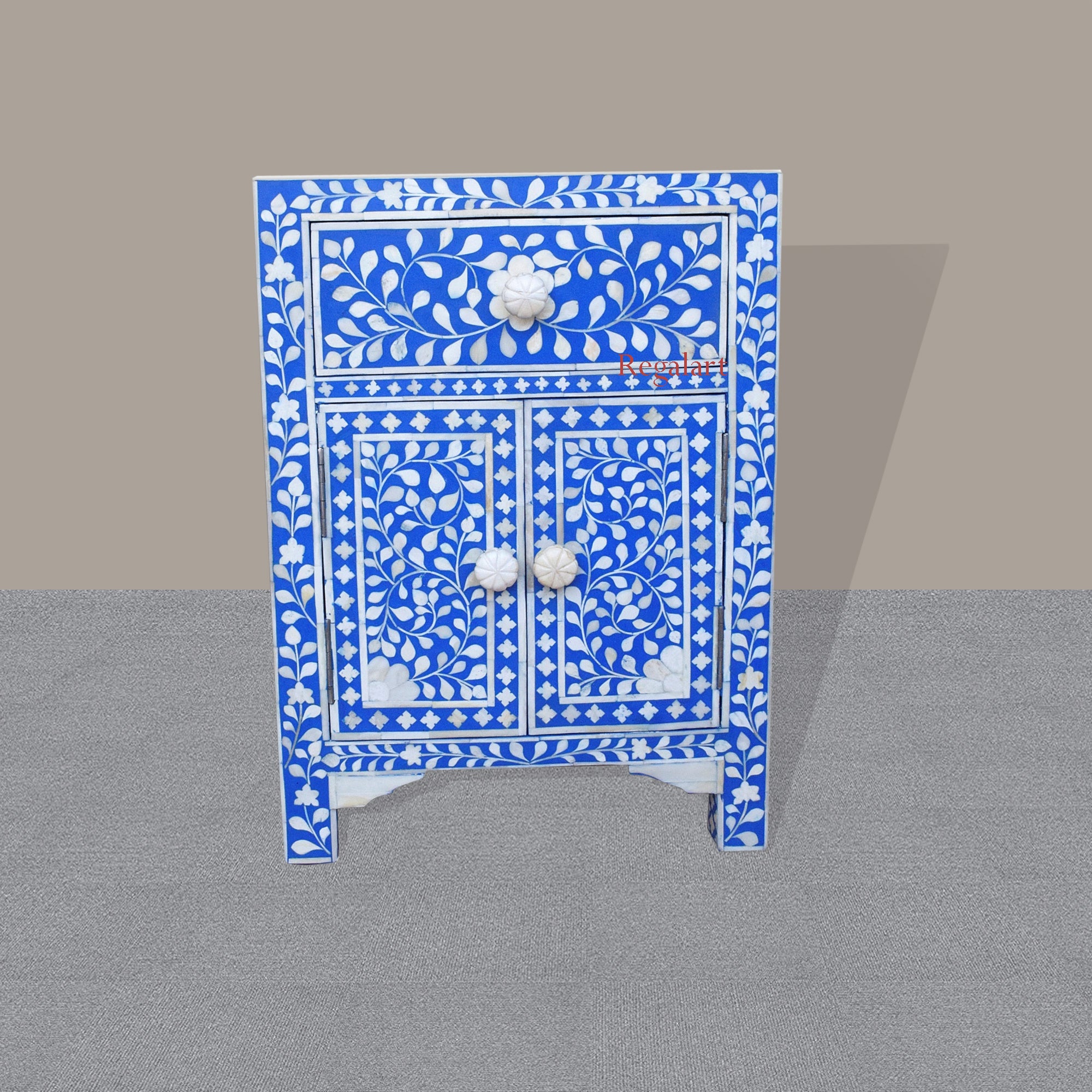 Front view of handmade bone inlay bedside table with floral design 

