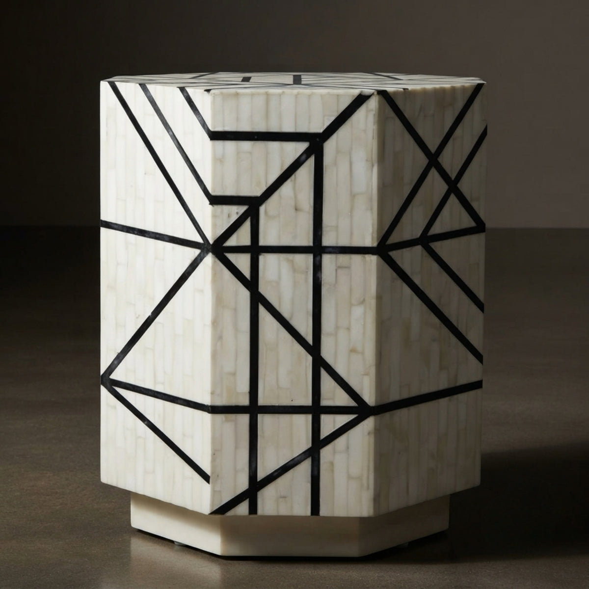 A hexagonal side table featuring a white mother-of-pearl inlay pattern with a black geometric line design, set against a dark brown background.