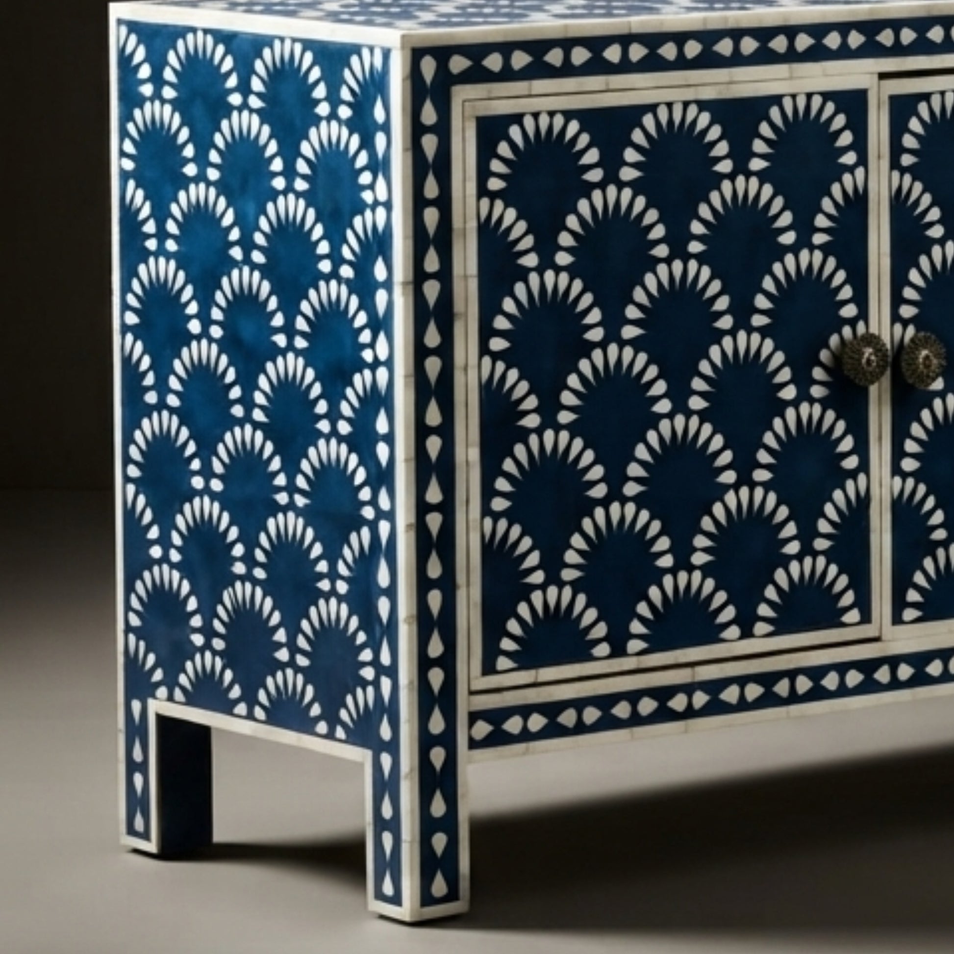 A decorative sideboard cabinet with a blue and white bohemian fan pattern, featuring two doors with ornate round knobs and a high leg height.