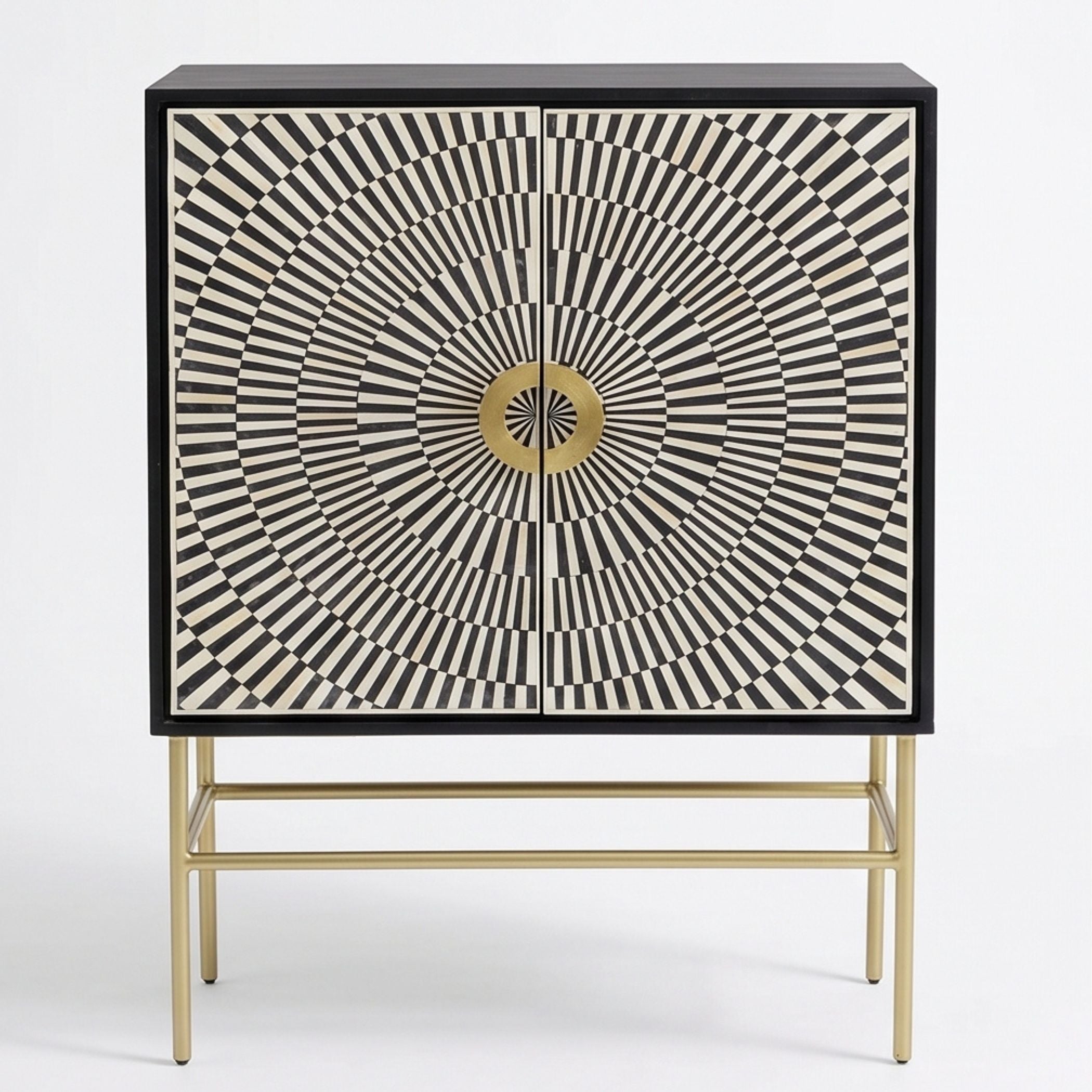 A modern two-door cabinet featuring a black and cream geometric sunburst pattern on the doors, with a central gold circular accent and a slim gold metal stand.