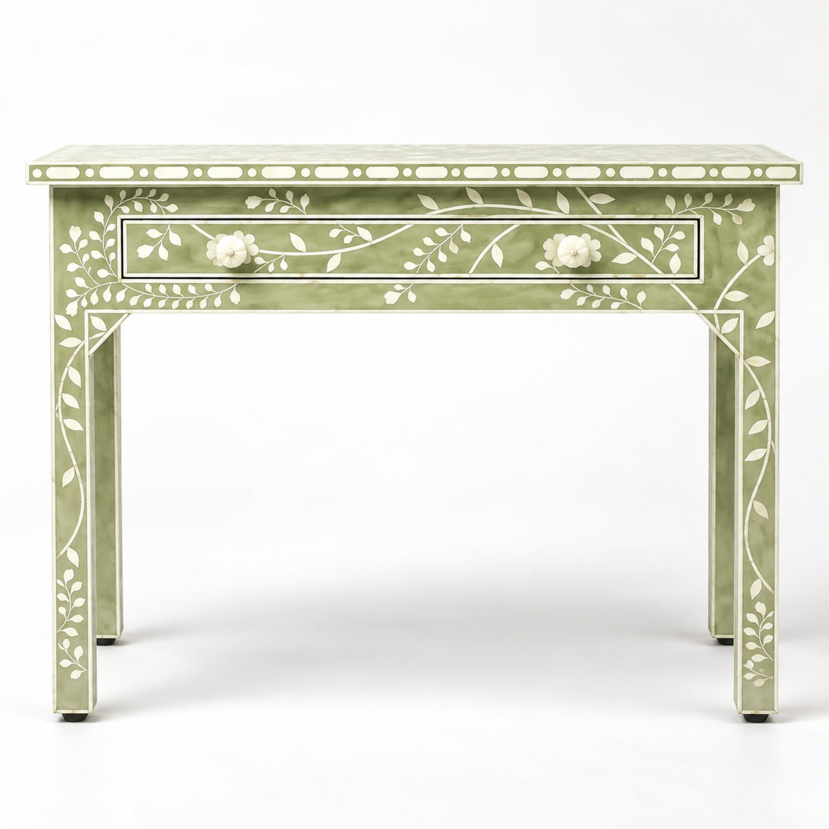 A light sage green console table with white inlay floral and vine patterns, featuring a single drawer with two round white knobs, set against a plain white background.