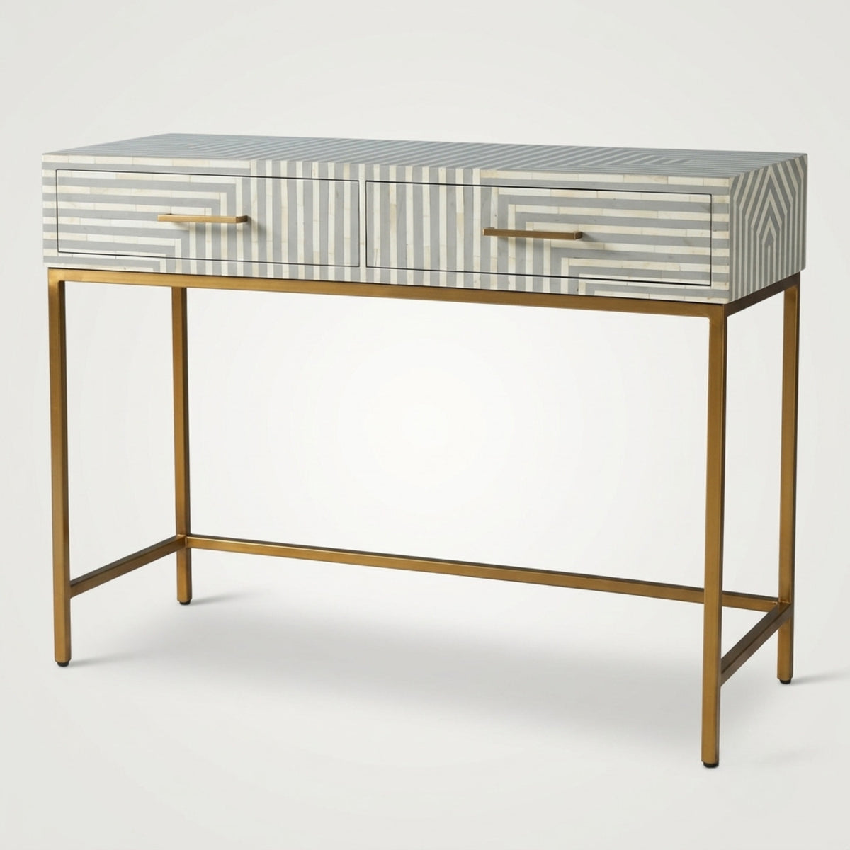 A modern two-drawer console table with a striped bone-in-wood top, gold metal legs, and gold handles, shown on a light gray background.