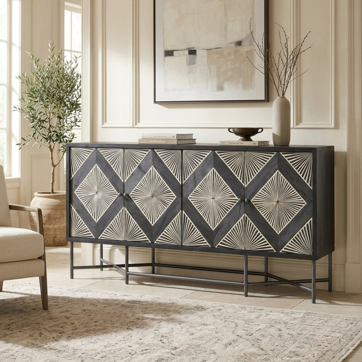 A modern sideboard or credenza with a dark charcoal gray finish and a repeating geometric diamond pattern made of light beige inlay, shown in a styled living room setting.