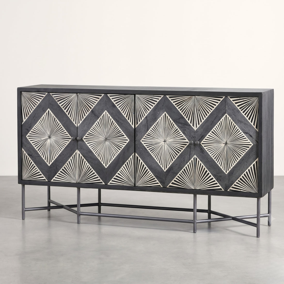A modern sideboard cabinet with a dark charcoal gray wood finish and intricate white inlay patterns forming repeating diamond and sunburst motifs on each door, supported by a slim black metal frame.
