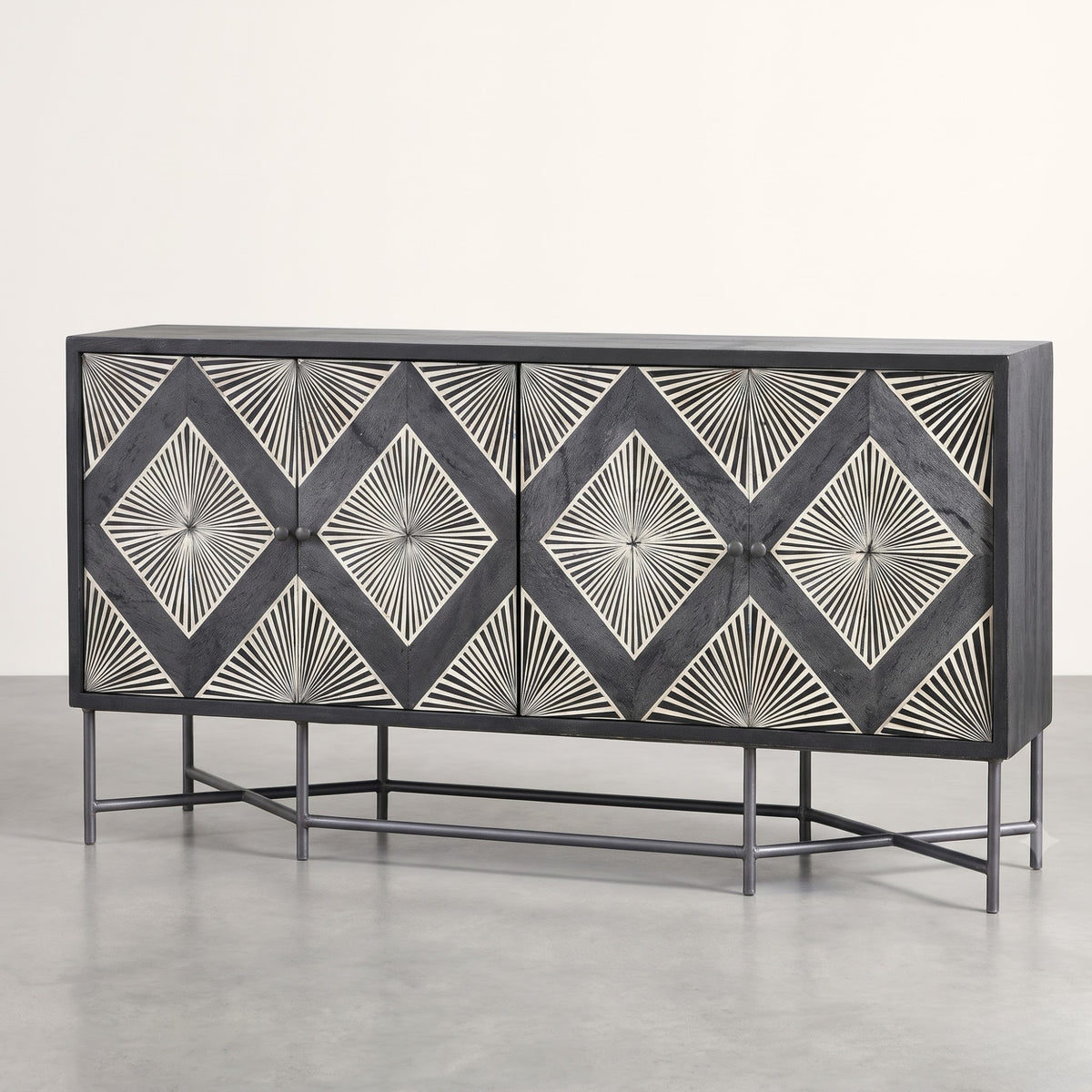 A modern sideboard cabinet with a dark charcoal gray wood finish and intricate white inlay patterns forming repeating diamond and sunburst motifs on each door, supported by a slim black metal frame.