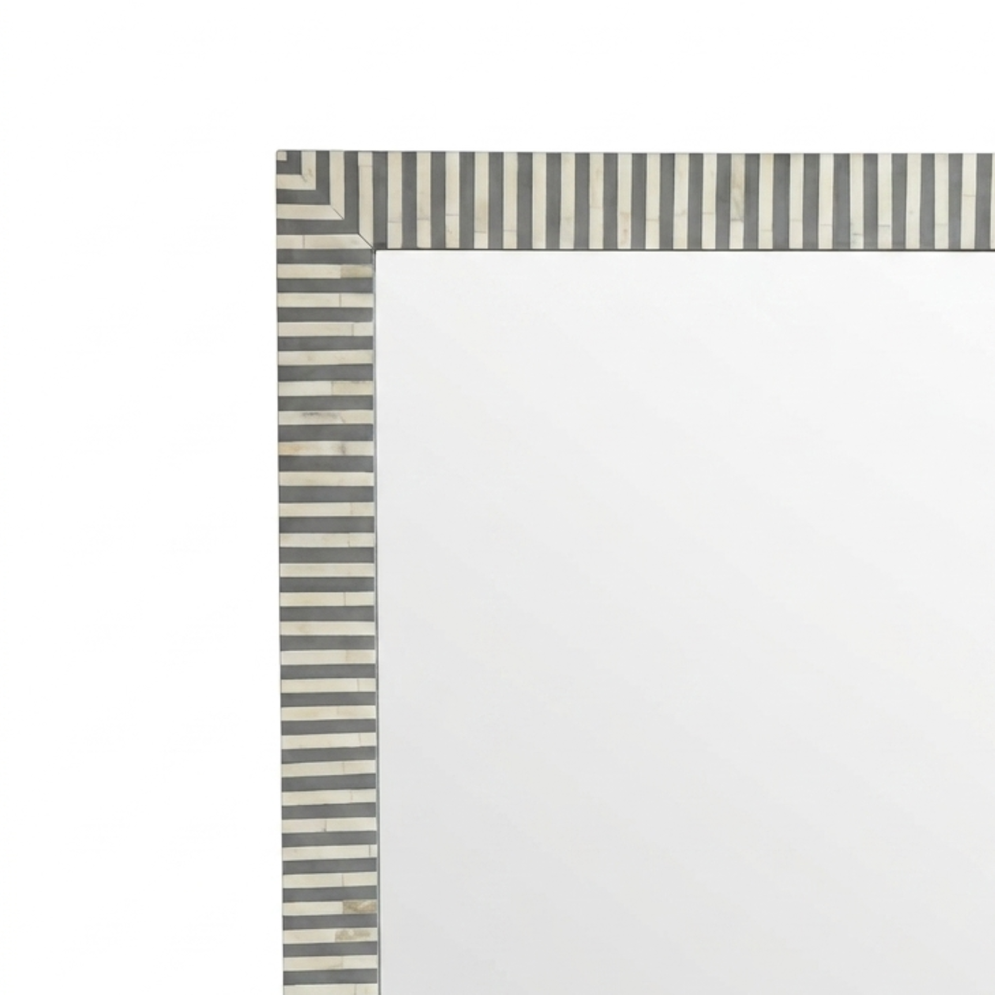 A close-up of a rectangular mirror with a striped border in gray and off-white tones, shown against a plain white background.