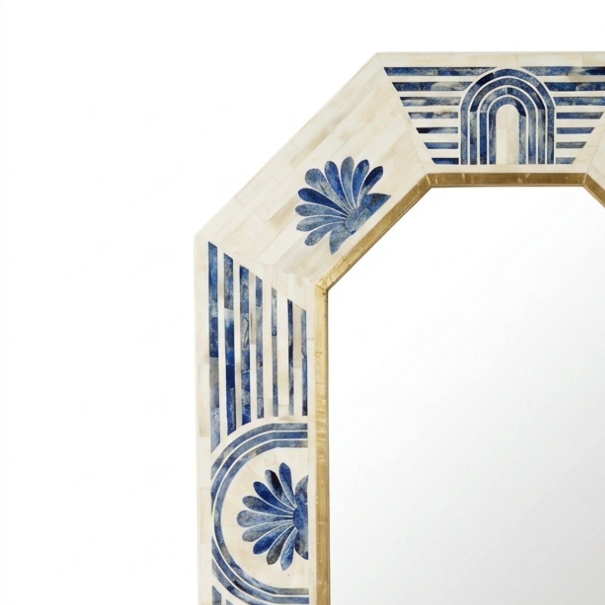 Hexagonal mirror frame with a cream-colored inlay featuring blue mosaic floral and geometric patterns, shown against a plain white background.