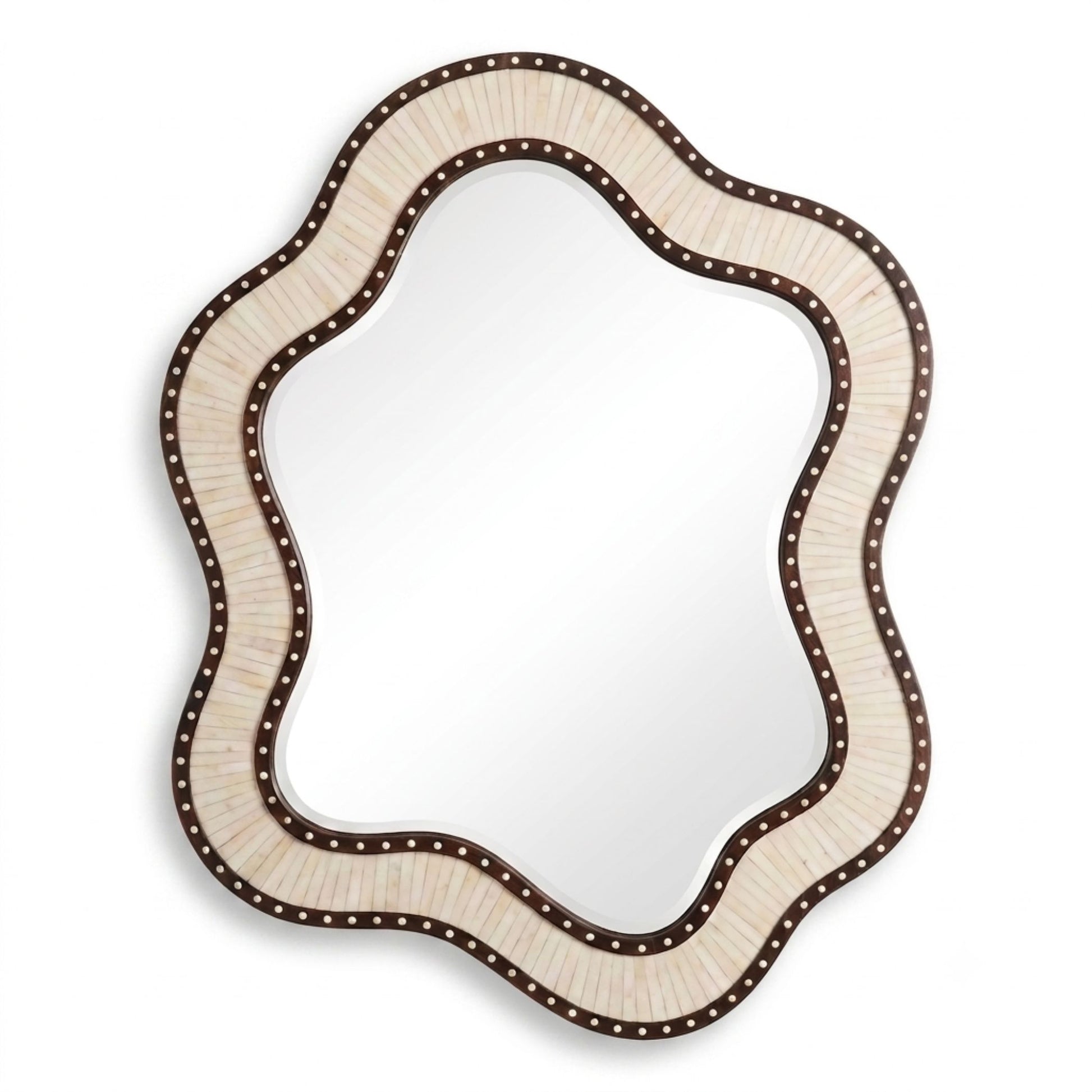 An asymmetrical scalloped wall mirror with a textured cream-colored frame and a dark brown border accented with small metallic studs, shown against a plain white background.