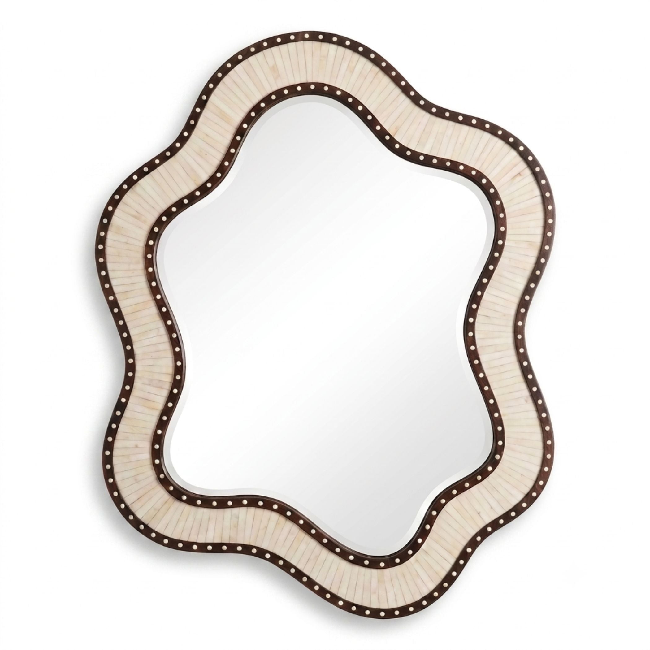 An asymmetrical scalloped wall mirror with a textured cream-colored frame and a dark brown border accented with small metallic studs, shown against a plain white background.