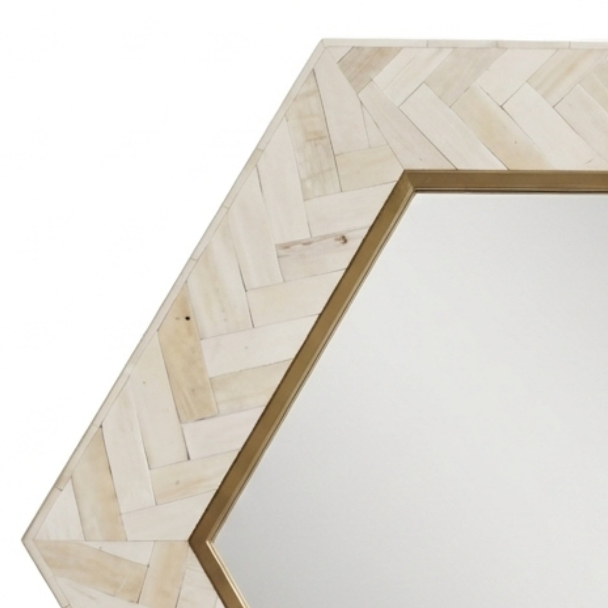 Hexagonal mirror with a light beige herringbone wood frame and a gold metal border, shown against a plain white background.