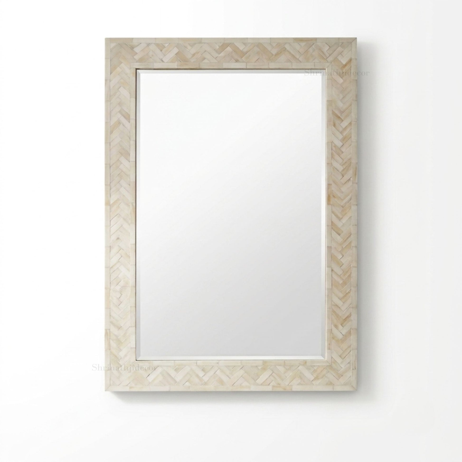A rectangular wall mirror with a light beige and white chevron-patterned frame, shown against a plain white background.