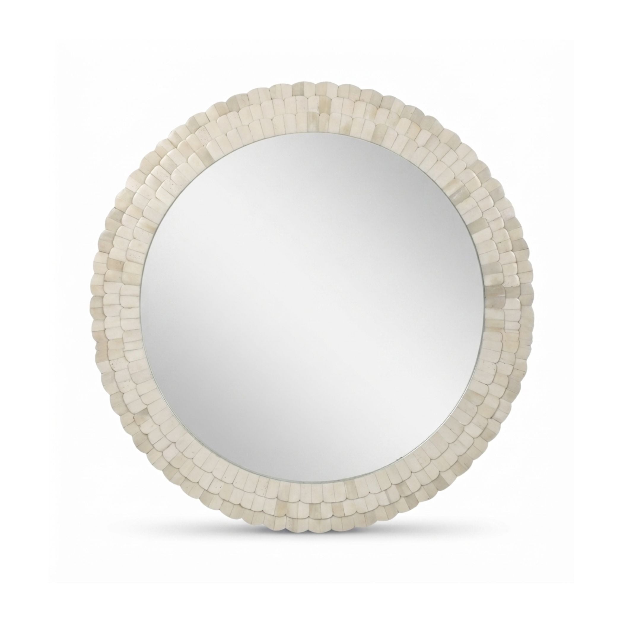 Round wall mirror with a textured, scalloped frame made of small stacked shell-like pieces in an off-white finish, shown on a plain white background.