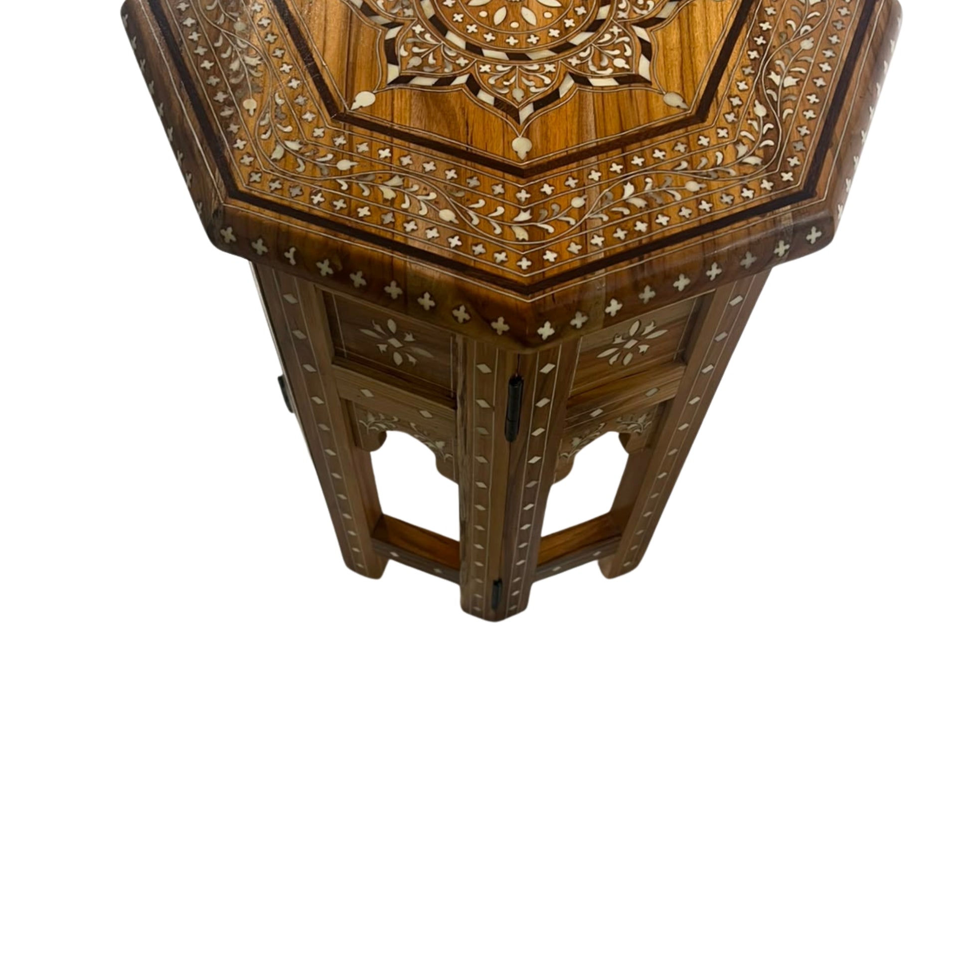 Hexagonal wooden side table with intricate floral inlay detailing on the top and legs, shown against a plain white background.