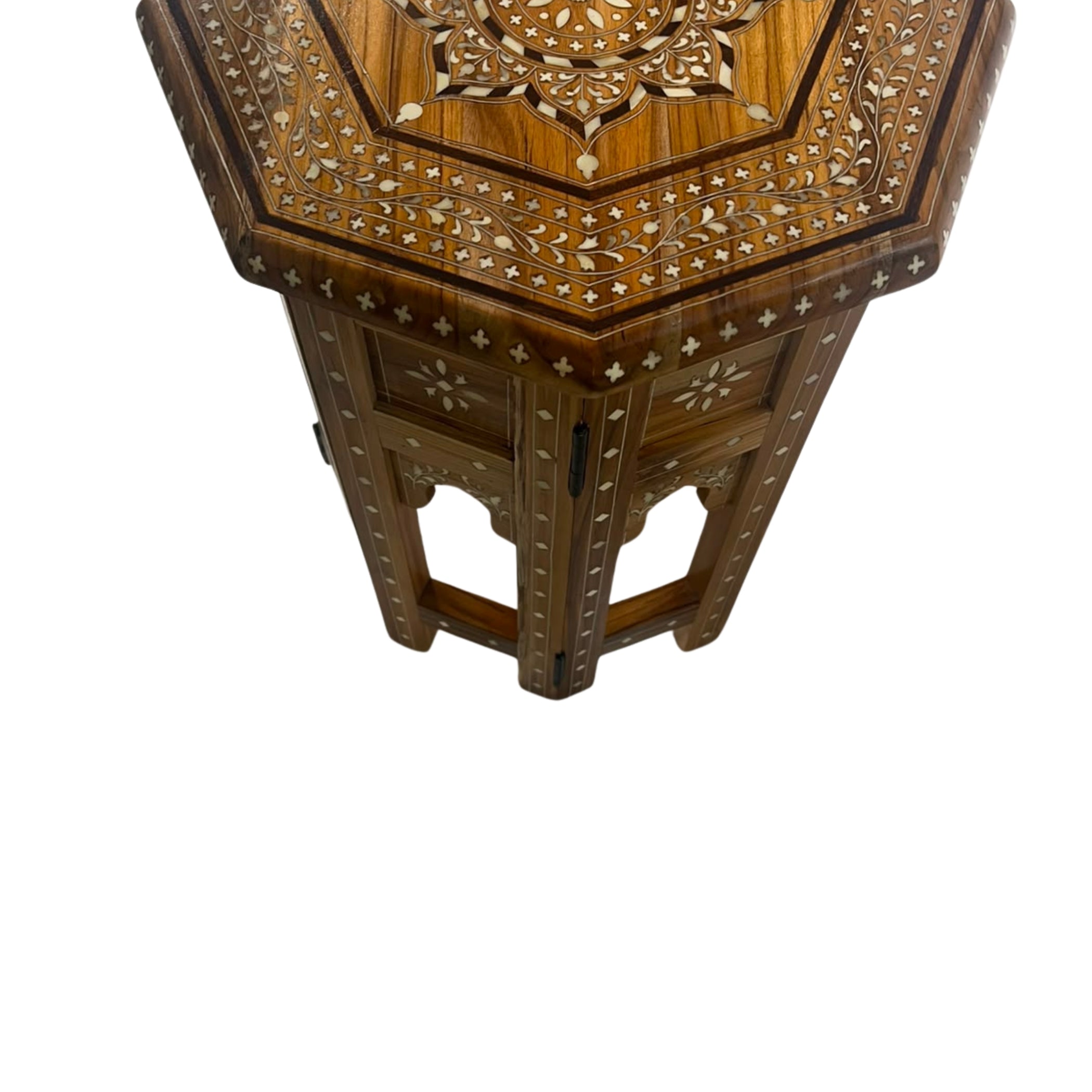 Hexagonal wooden side table with intricate floral inlay detailing on the top and legs, shown against a plain white background.
