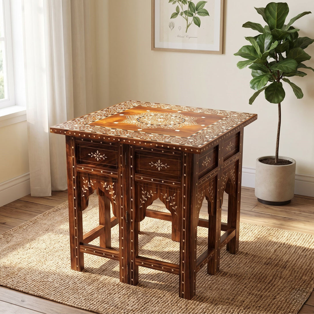 An ornate dark brown wooden end table with intricate mother-of-pearl inlay on the top and carved legs, styled in a bright room on a jute rug next to a potted plant.