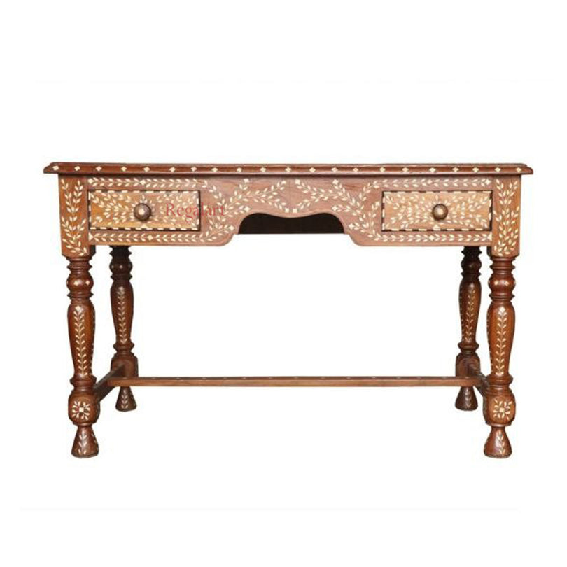 An ornate wooden console table with carved floral details and turned legs, shown against a plain white background.