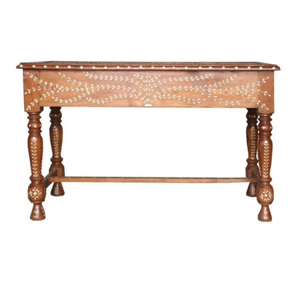 A rustic wooden console table with turned legs and white inlay leaf patterns on the front panel, shown against a plain white background.