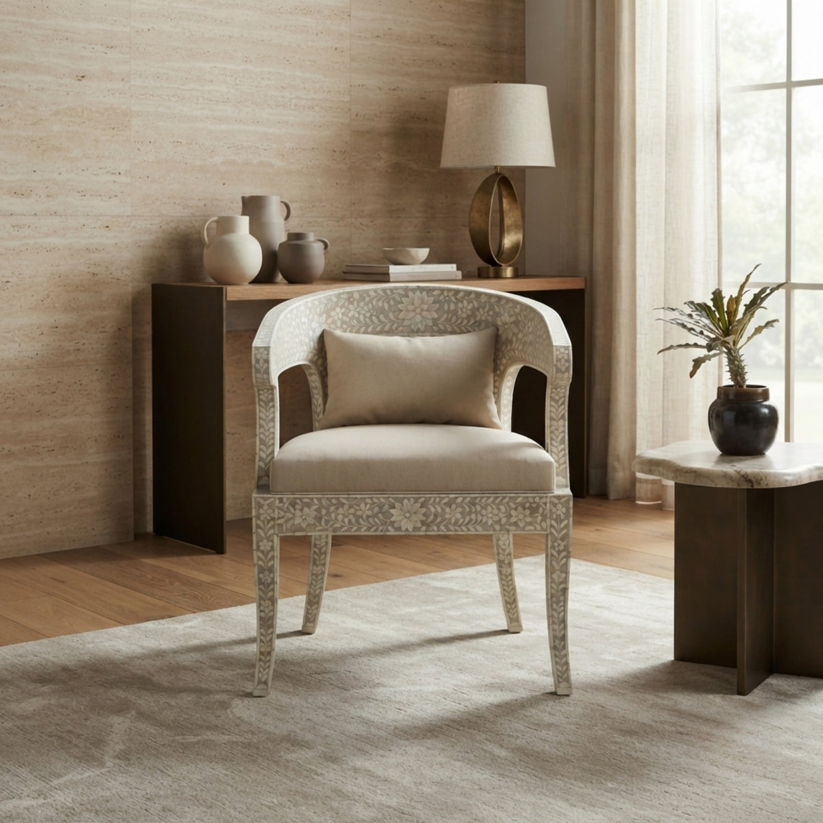 A modern upholstered accent chair with a light beige seat and back cushion, set in a styled living room next to a side table and console table.