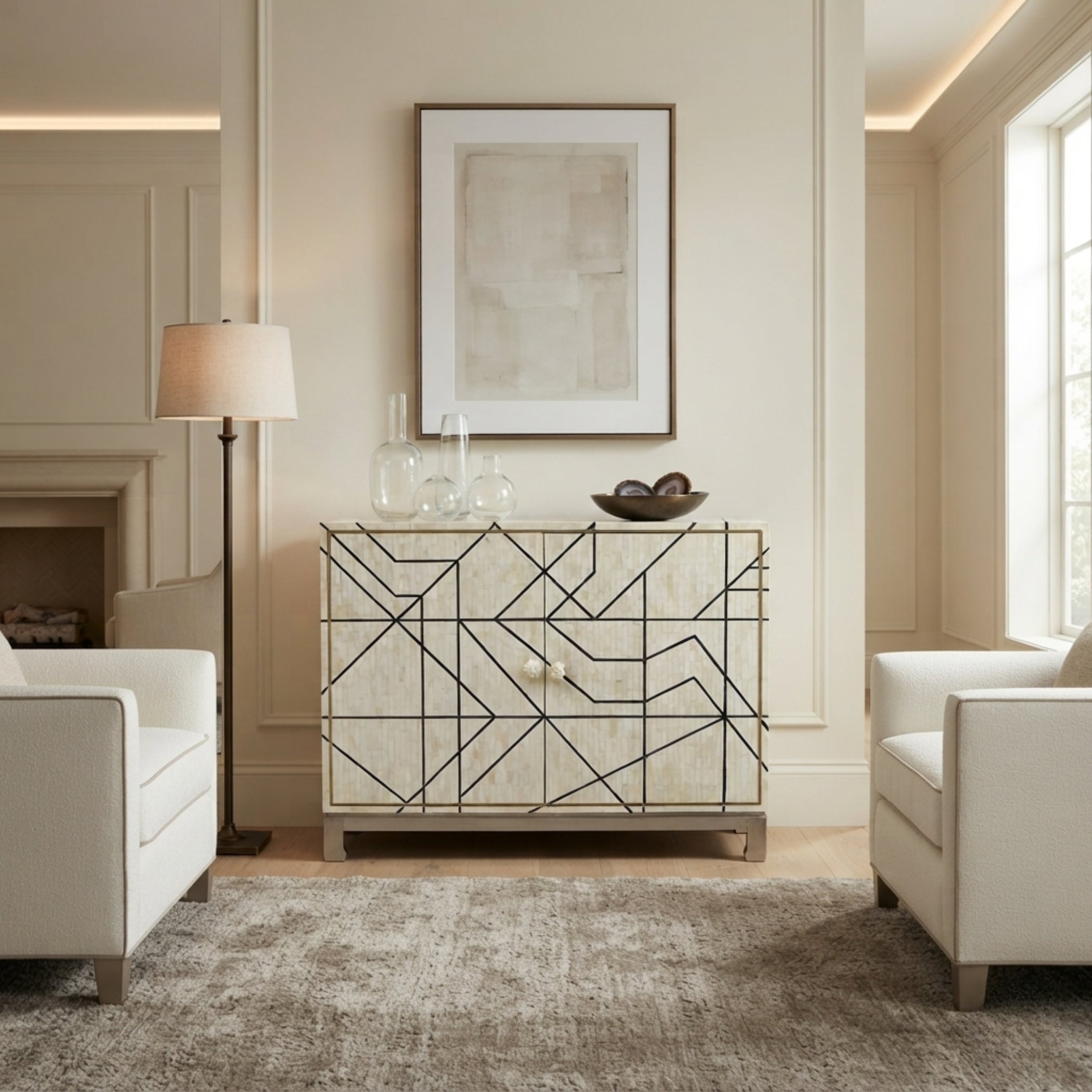 A modern sideboard cabinet with a geometric black wireframe pattern over a light beige wood-grain finish, styled in a bright, contemporary living room.