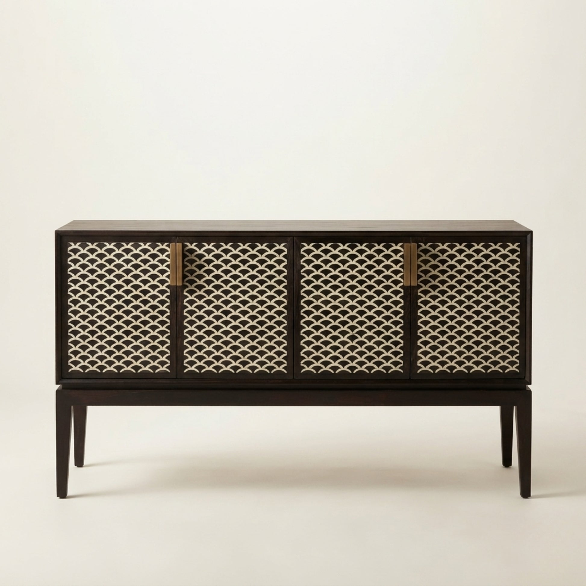 A mid-century modern sideboard cabinet with a dark wood frame and four woven cane doors, accented with four vertical brass handles, set against a plain off-white background.