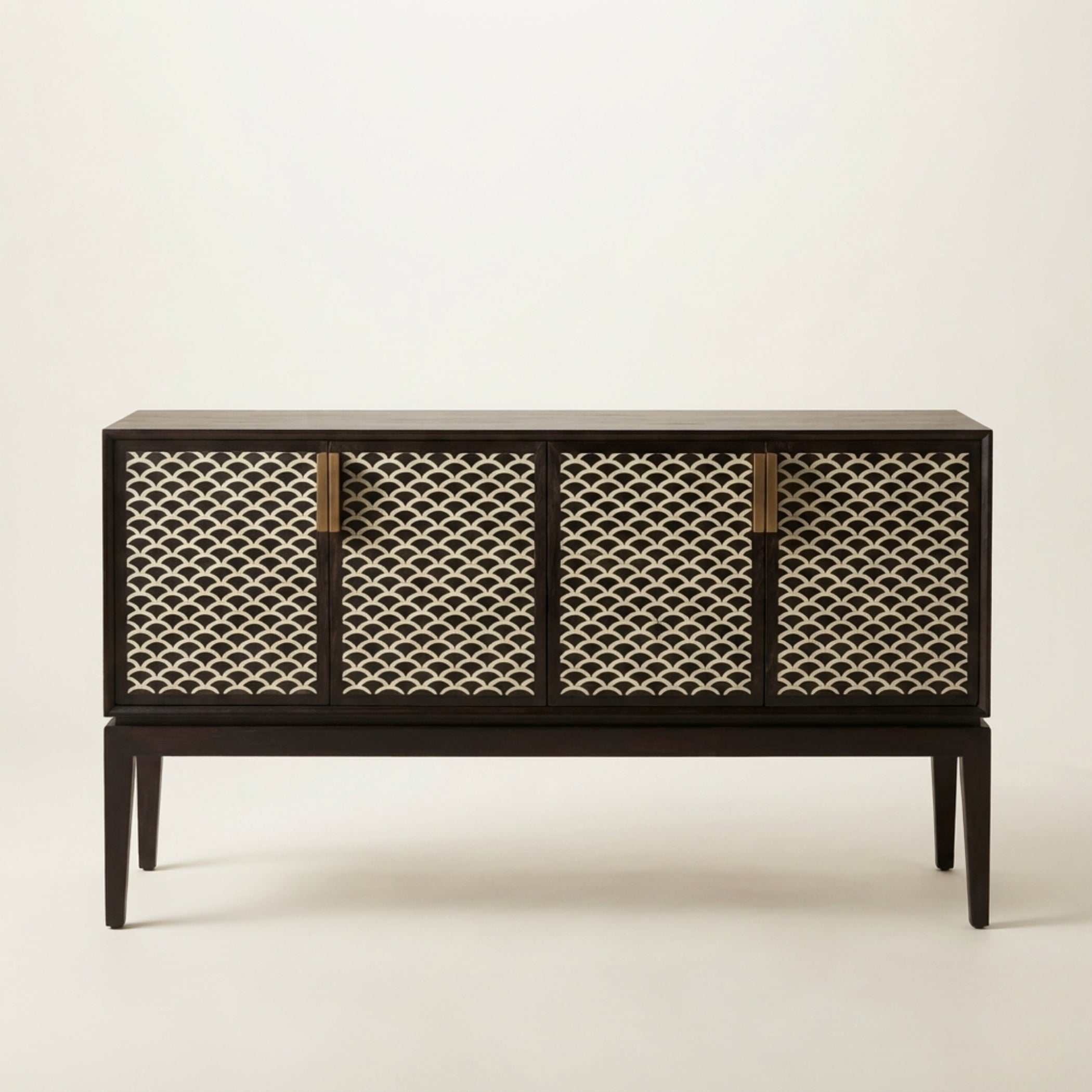 A mid-century modern sideboard cabinet with a dark wood frame and four woven cane doors, accented with four vertical brass handles, set against a plain off-white background.