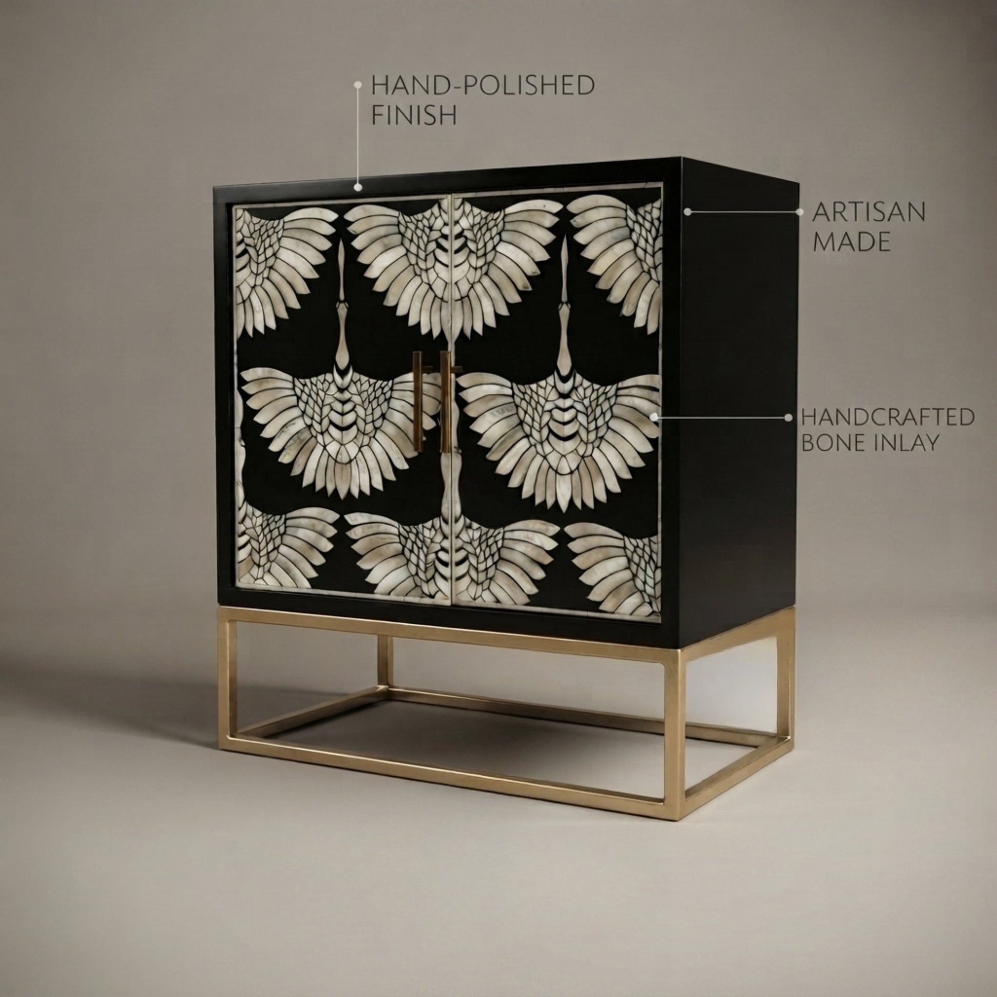 A black wooden cabinet with ornate bone-inlay bird motifs on the doors, supported by a gold metal frame base, shown against a neutral gray background with feature callout text overlays.