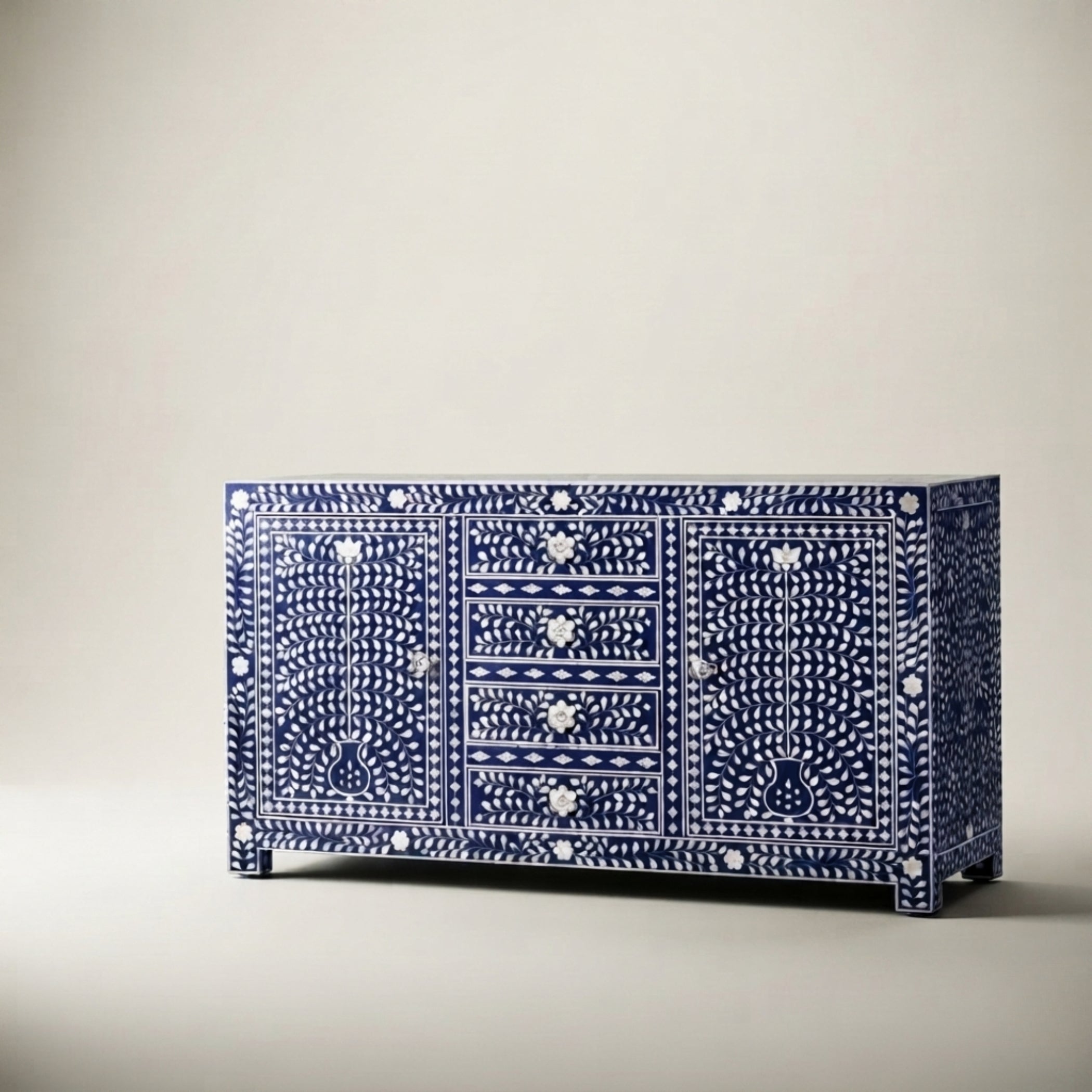 A blue and white bone-inlay sideboard cabinet with three drawers, photographed against a neutral light gray background.
