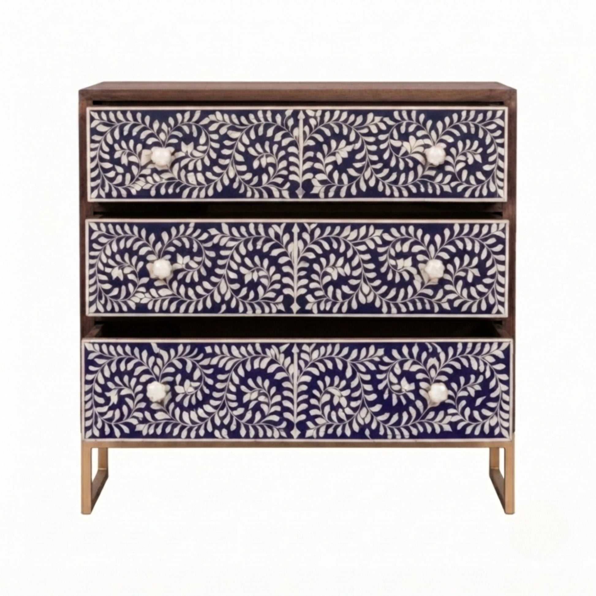 A three-drawer chest of drawers with dark wood framing and legs, featuring intricate white bone or shell floral inlays on the drawer fronts, set against a plain white background.