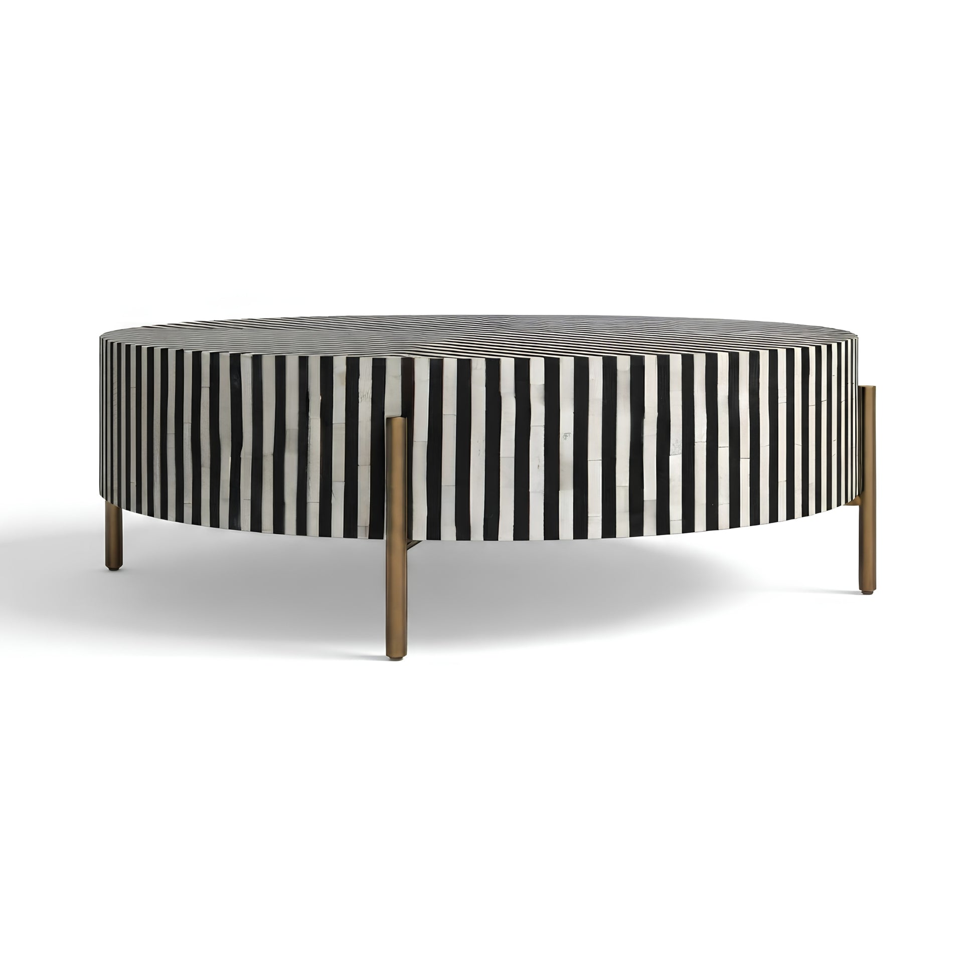 Round coffee table with a black and white vertically striped bone-in shell side panel, a dark gray wood top, and slim gold metal legs, shown on a white background.