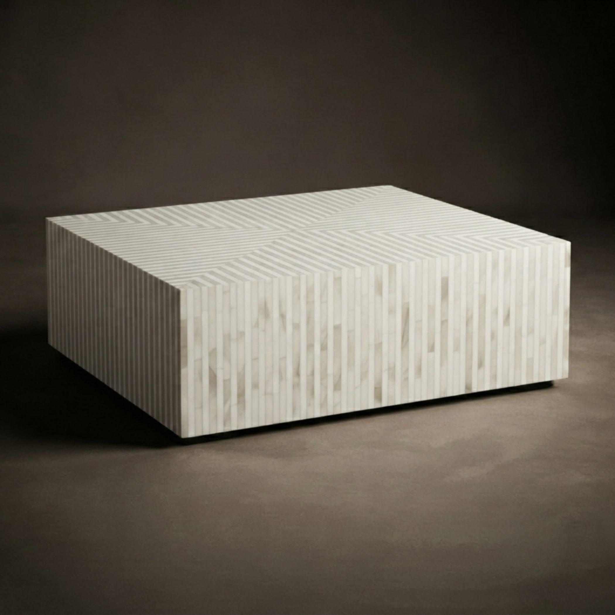 A modern rectangular coffee table with a textured, vertically striped bone-in wood top and sides, shown on a dark brown studio background.