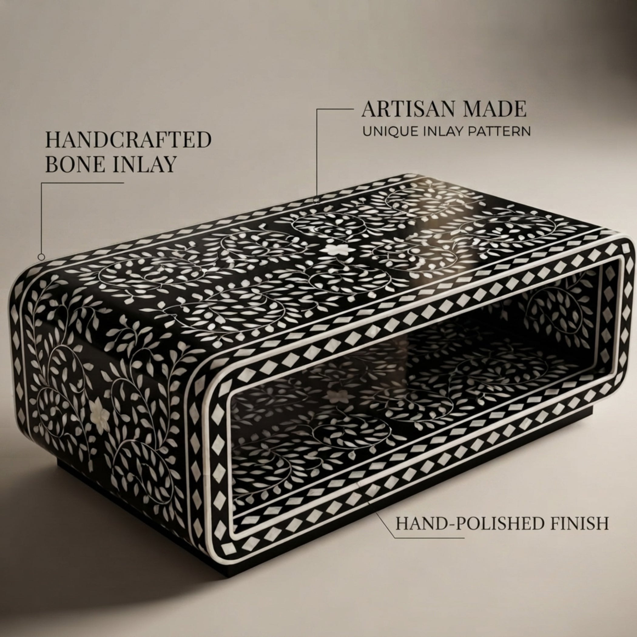 A rectangular black decorative box with white bone-inlay floral and geometric patterns, shown on a neutral beige background with text callouts describing the handcrafted bone inlay, artisan-made unique inlay pattern, and hand-polished finish.
