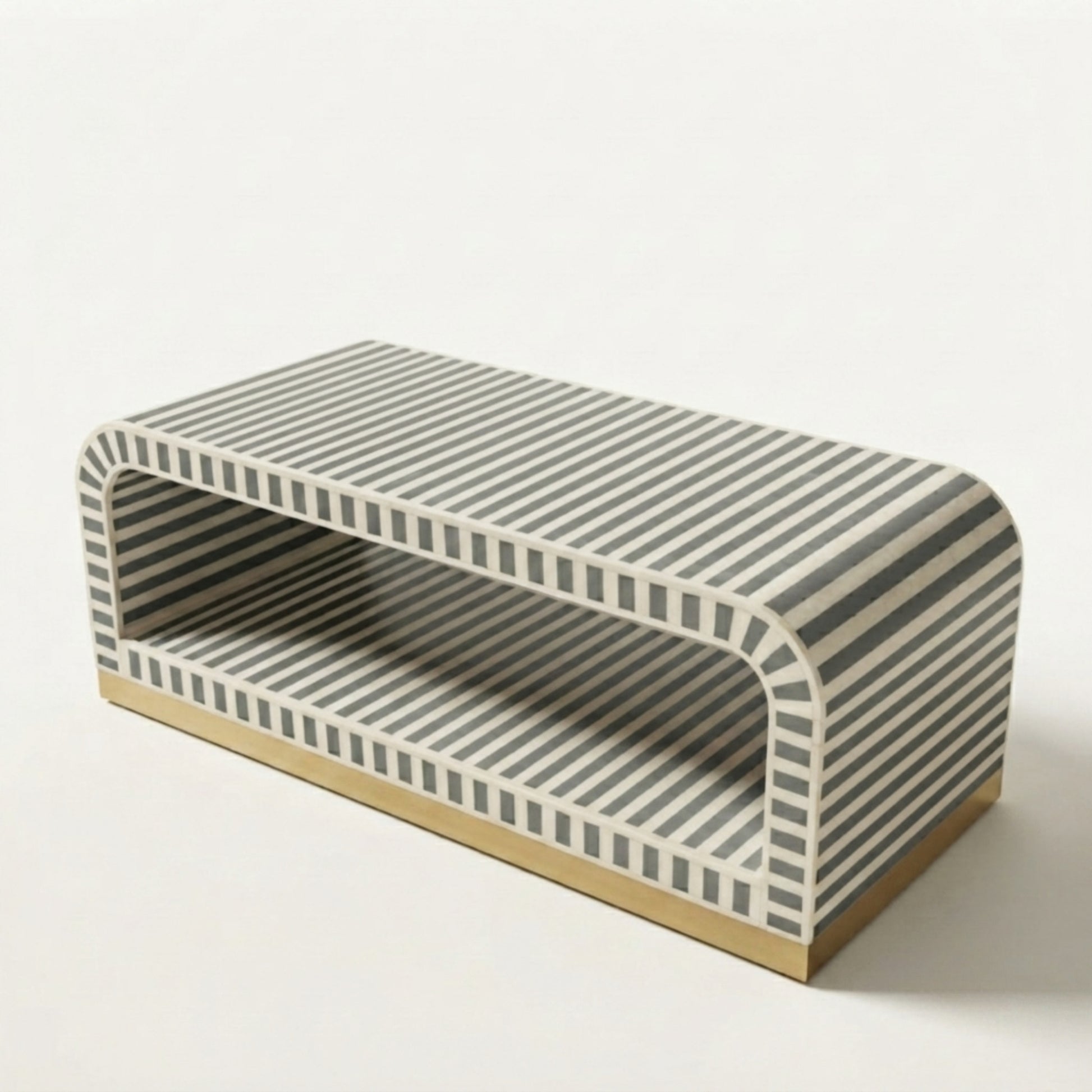 A modern rectangular bench with a curved backrest, featuring a gray and white striped pattern on the upholstered seat and back, with a light natural wood base, shown on a clean off-white background.