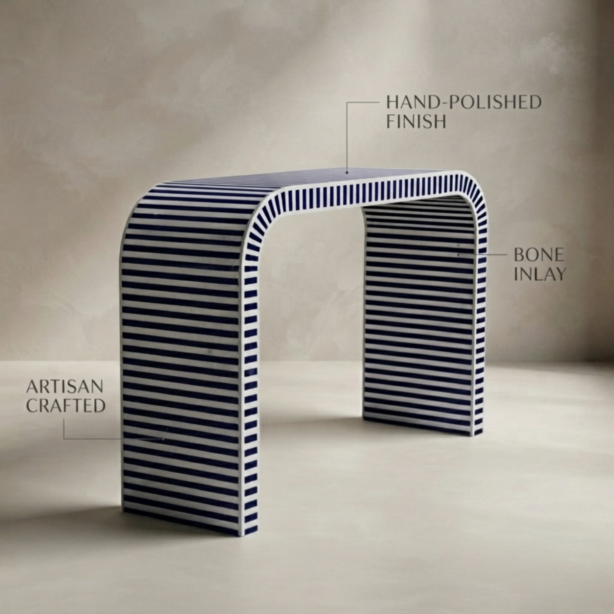 An arched console table with a hand-polished finish and bone inlay, featuring dark blue and white horizontal stripes, shown against a neutral beige background with text callouts.