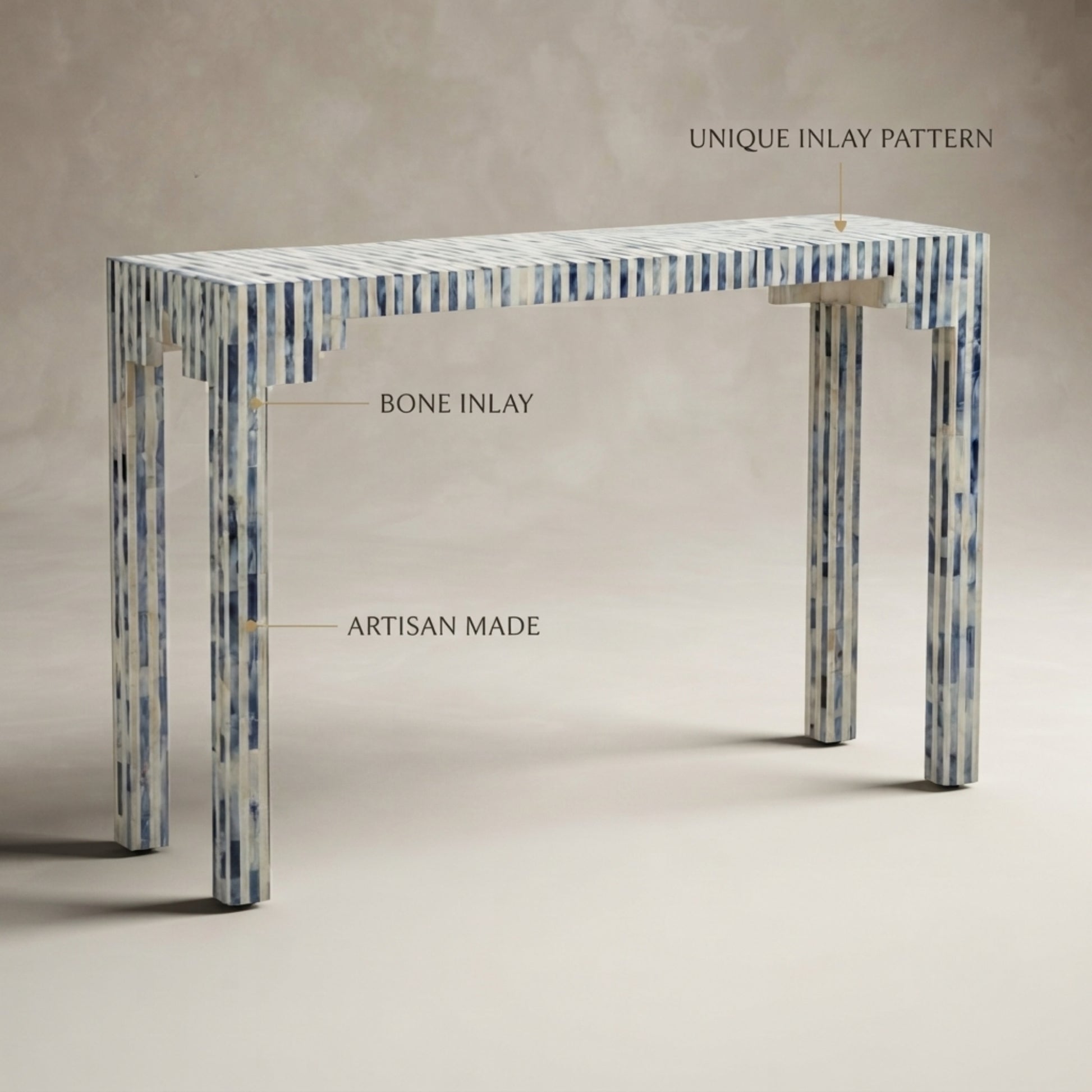 A console table with a blue and white bone inlay pattern, shown with text callouts reading 'UNIQUE INLAY PATTERN', 'BONE INLAY', and 'ARTISAN MADE' against a neutral beige background.