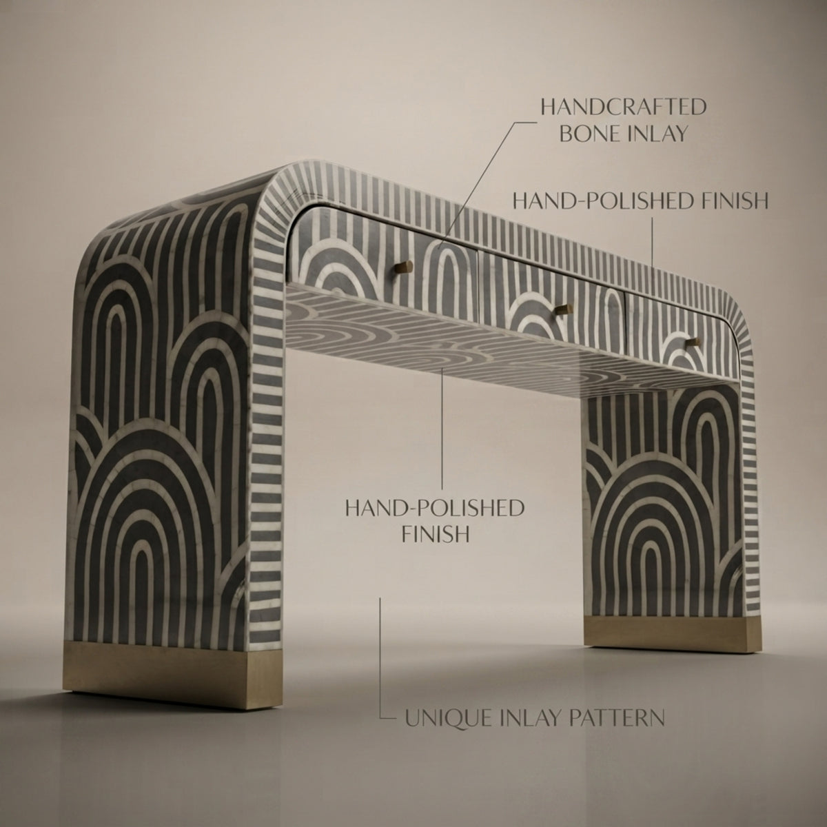 A console table with a black and white geometric inlay pattern and gold-toned metal bases, shown with text callouts highlighting its handcrafted bone inlay, hand-polished finish, and unique inlay pattern.