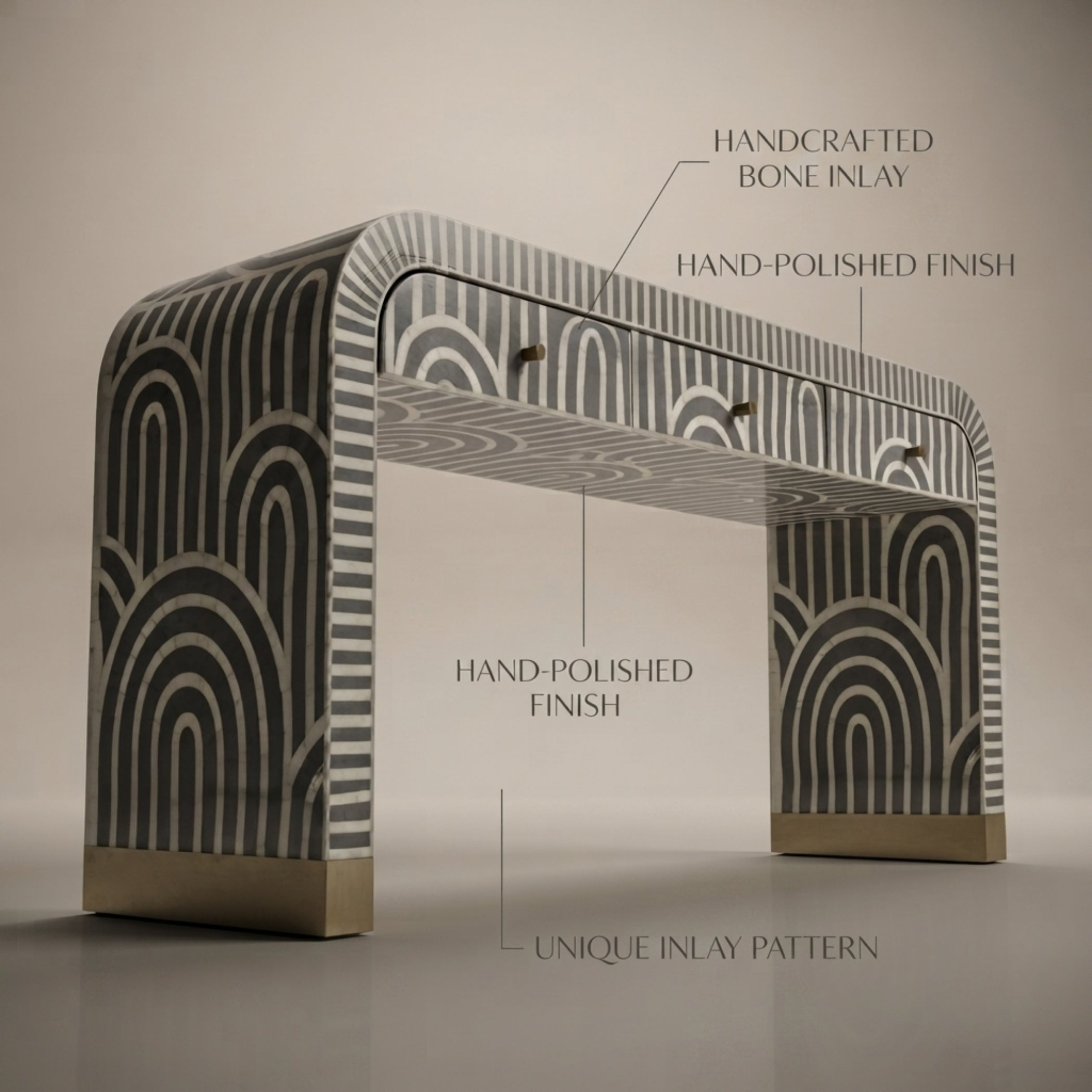 A console table with a black and white geometric inlay pattern and gold-toned metal bases, shown with text callouts highlighting its handcrafted bone inlay, hand-polished finish, and unique inlay pattern.