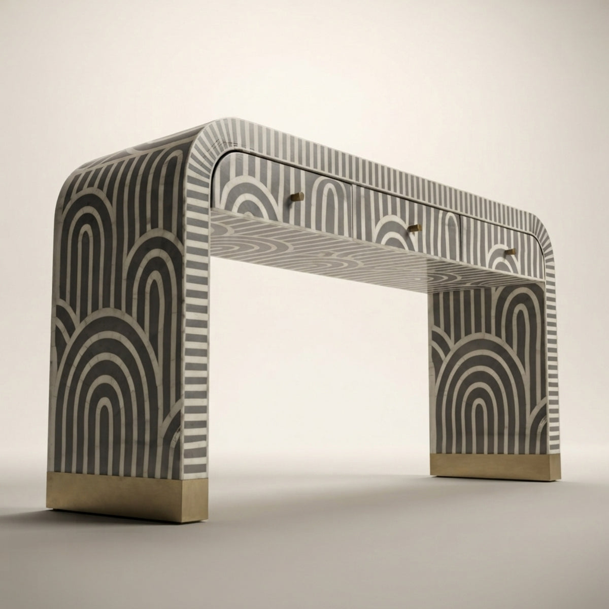 An arched console table with a gray and white geometric arch pattern and brushed gold metal bases, shown on a neutral light gray background.
