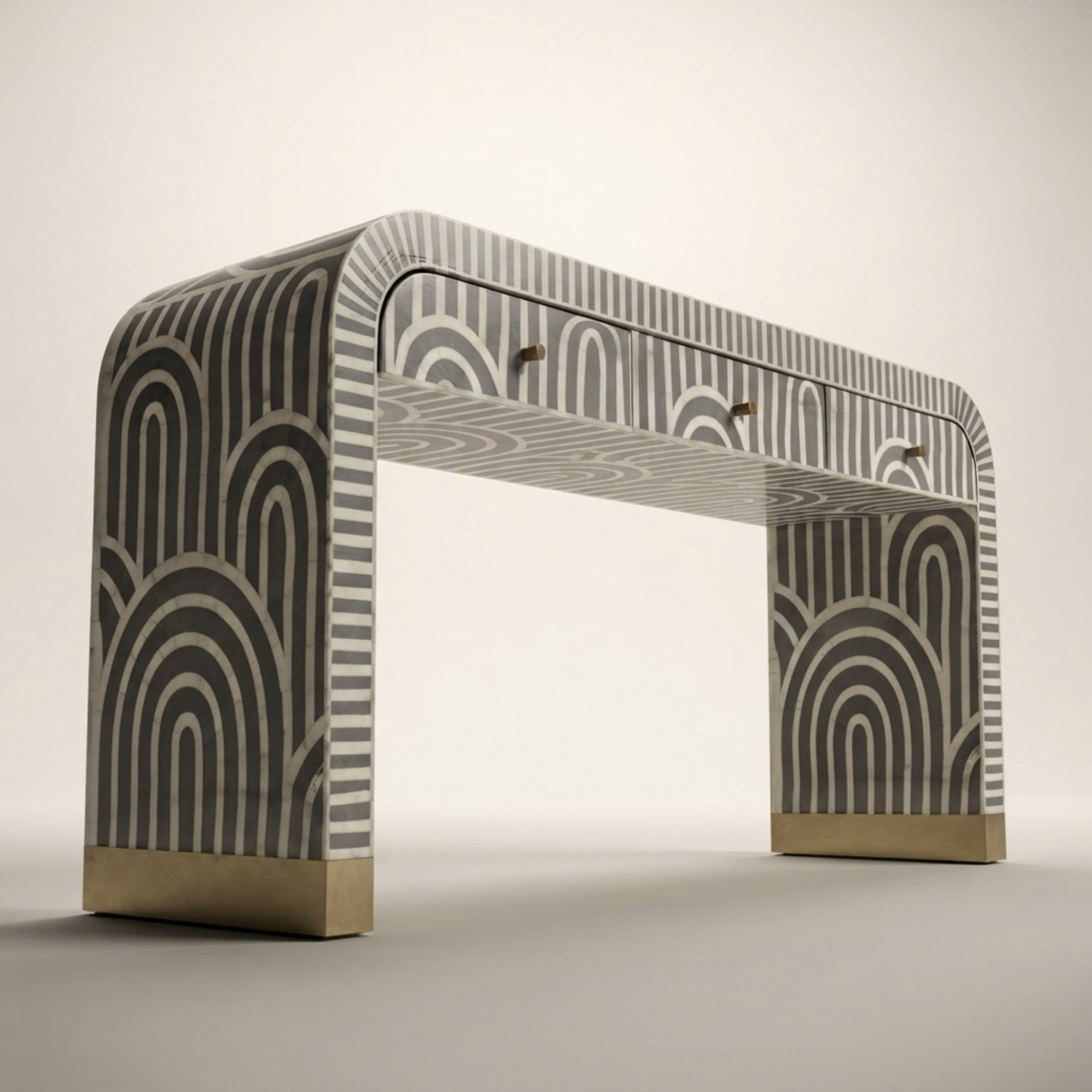 An arched console table with a gray and white geometric arch pattern and brushed gold metal bases, shown on a neutral light gray background.