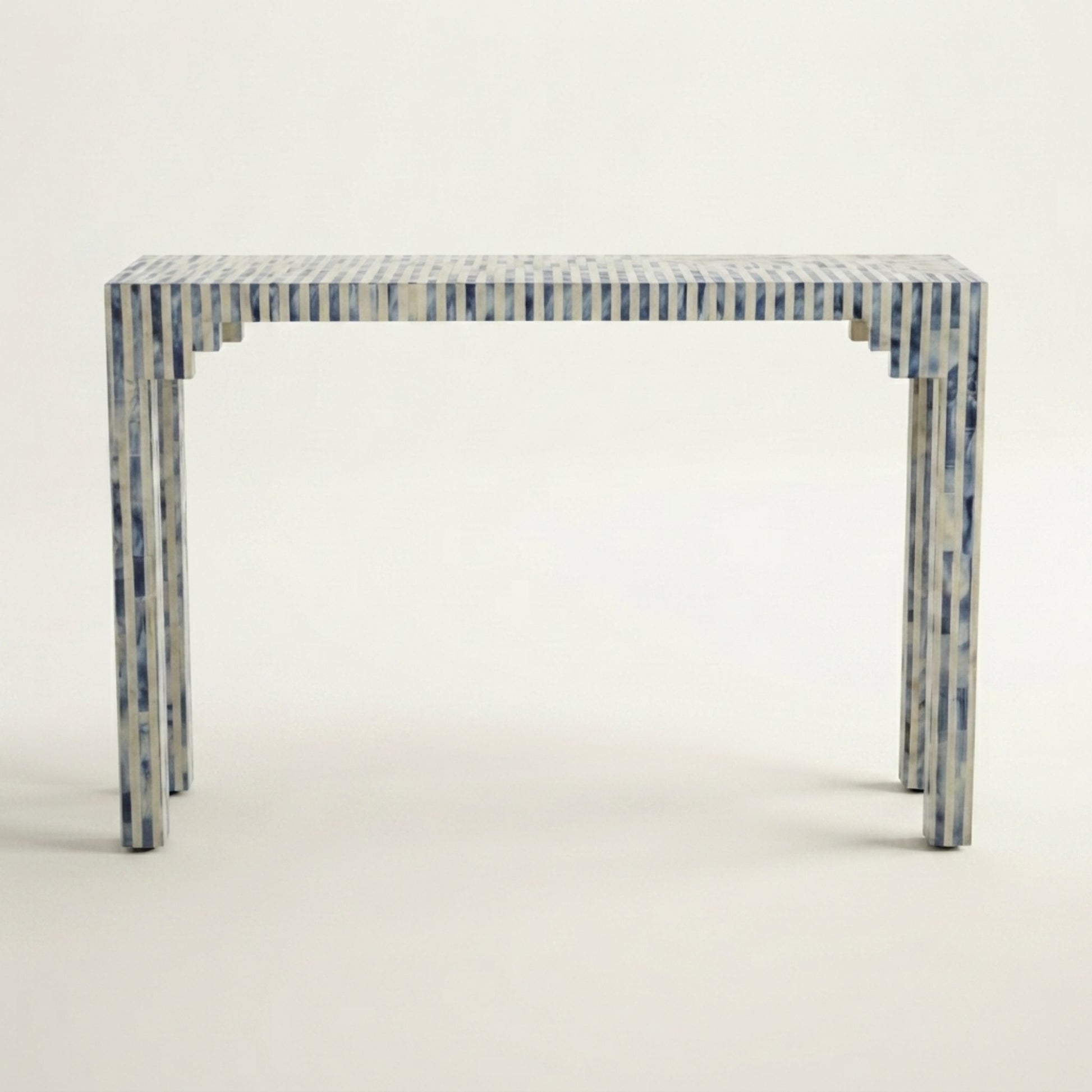 A rectangular console table with a blue and white striped bone-inlay finish, shown from a front-three-quarter angle against a plain off-white background.