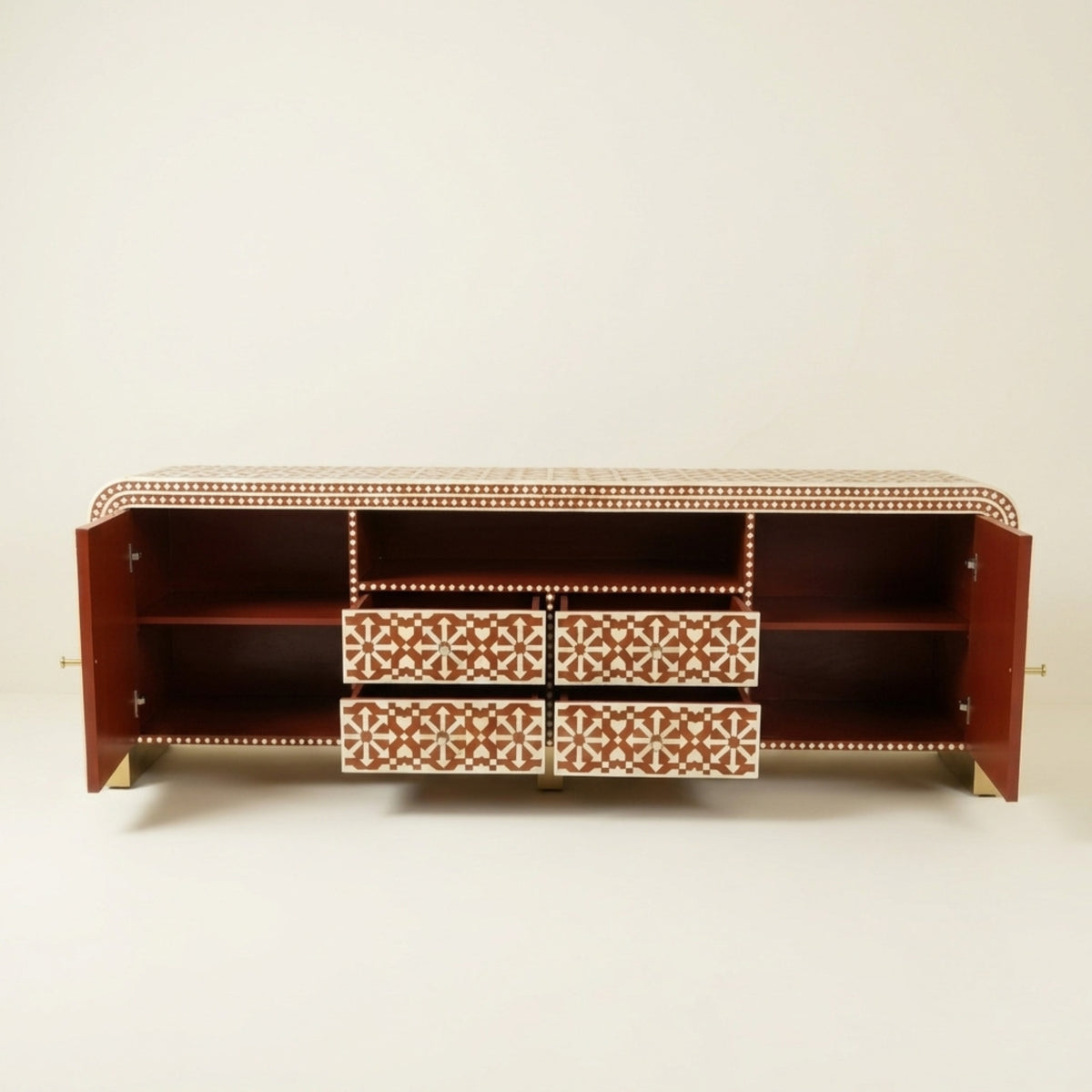 A reddish-brown wooden console cabinet with open side doors and four patterned drawers in the center. The drawers feature a cream and brown geometric inlay design, and the cabinet is set against a plain light beige background.