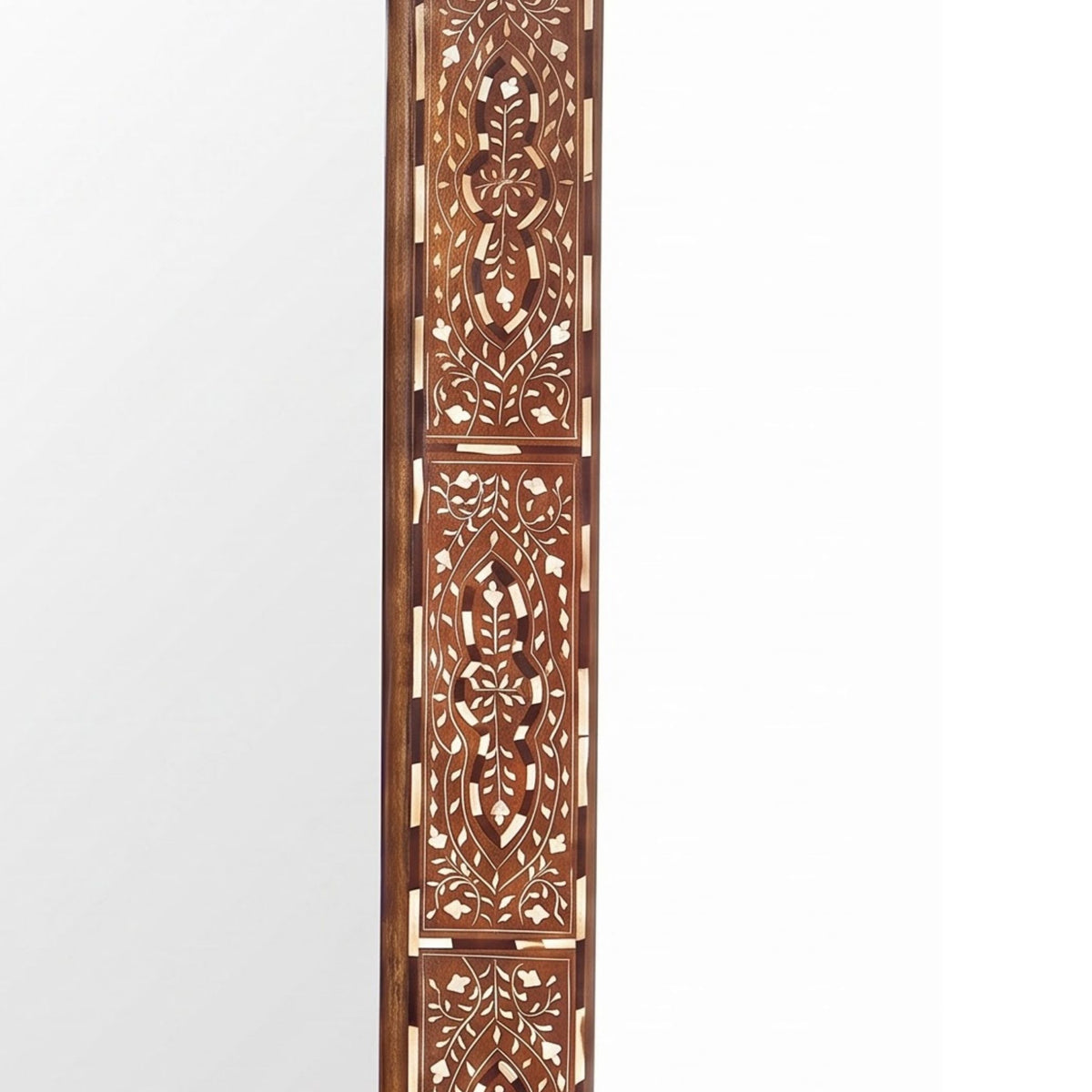 A tall, narrow wooden decorative panel with intricate geometric and floral cutout patterns, featuring warm brown wood and light beige inlay details, set against a plain white background.