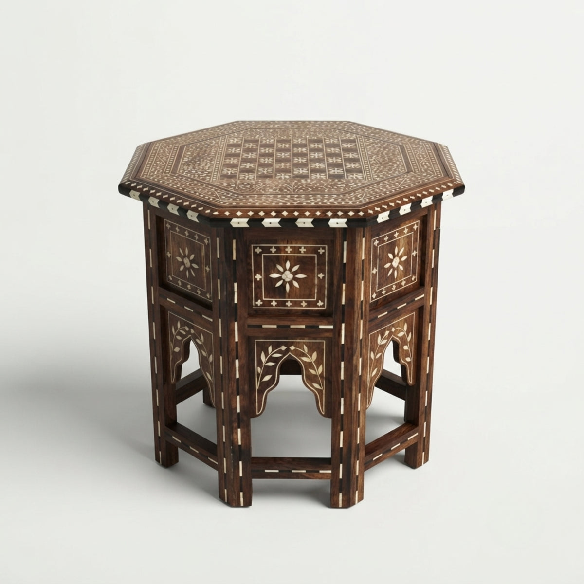 An octagonal wooden side table with intricate inlay patterns, featuring a dark brown wood base and light beige bone or mother-of-pearl geometric details, set against a plain light gray background.