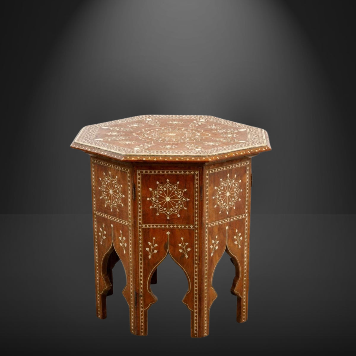 An octagonal wooden side table with intricate inlay work, featuring a warm brown finish and detailed cream-colored geometric and floral patterns, set against a dark gray gradient background.