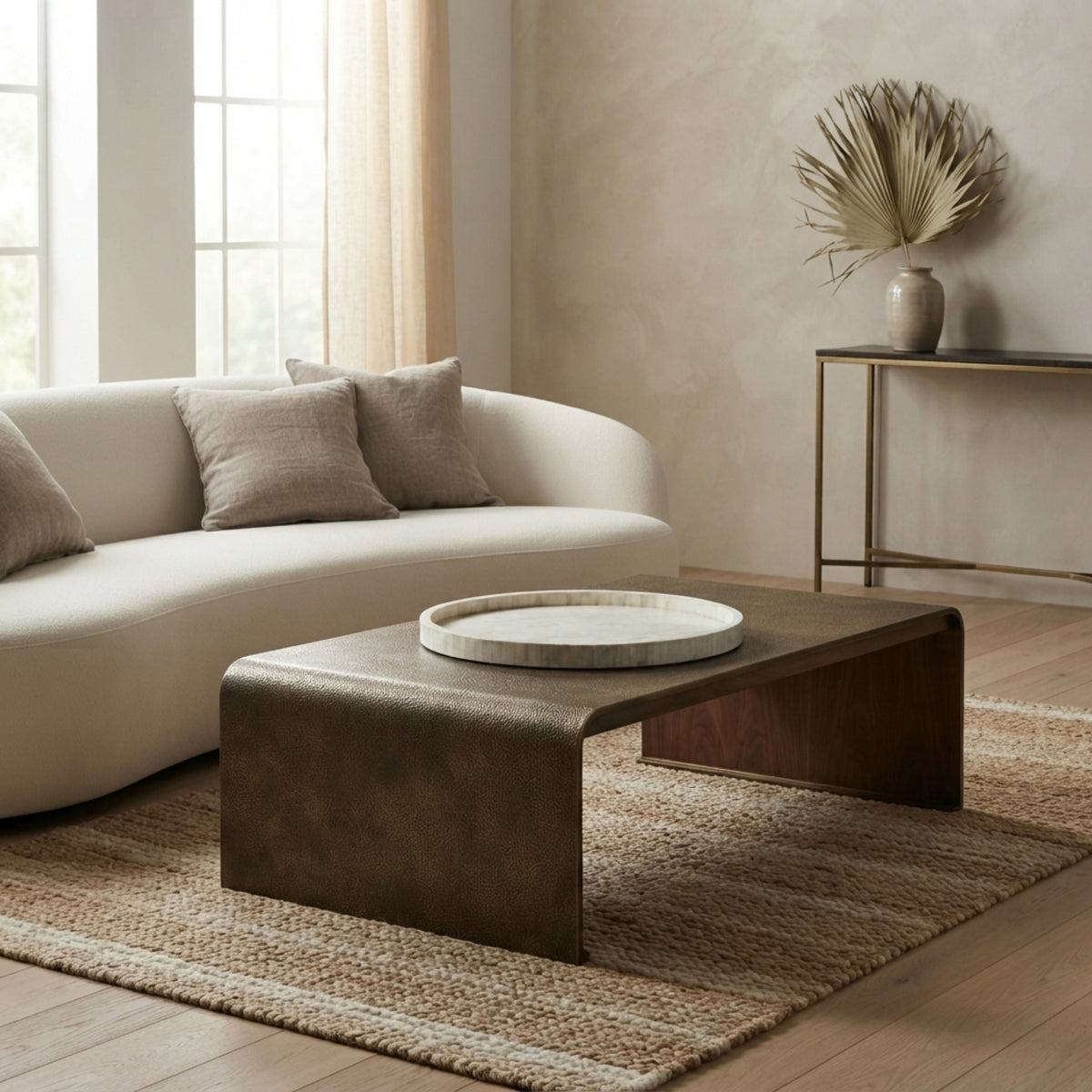 A modern rectangular coffee table with a dark brown textured top and a light wood base, styled in a living room setting on a woven rug next to a cream-colored sofa.