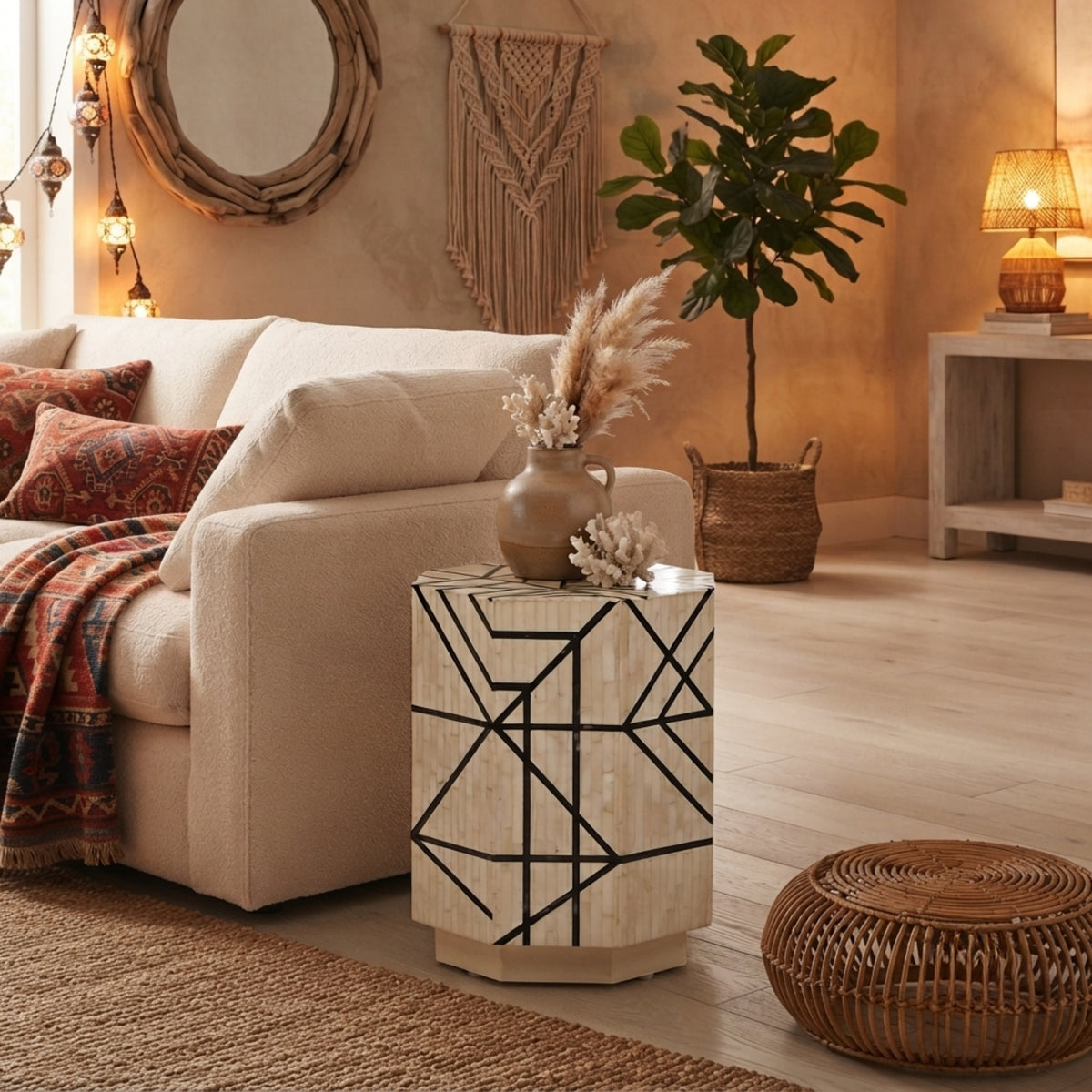 A bohemian-style side table with a cream wood grain finish and black geometric line patterns, styled in a warm, rustic living room next to a beige sofa.